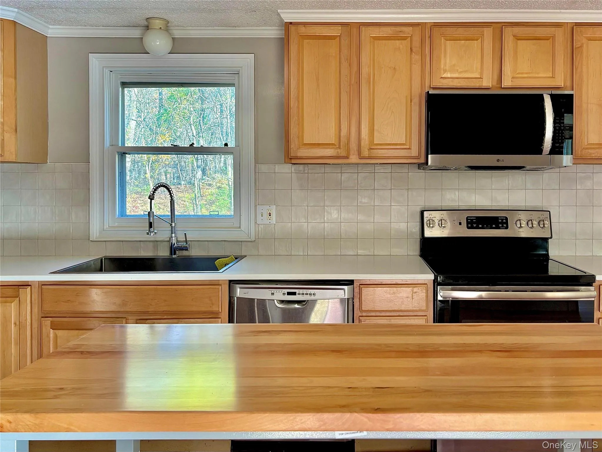 New Quartz countertops, new tile backsplash New Quartz countertops, new tile backsplash