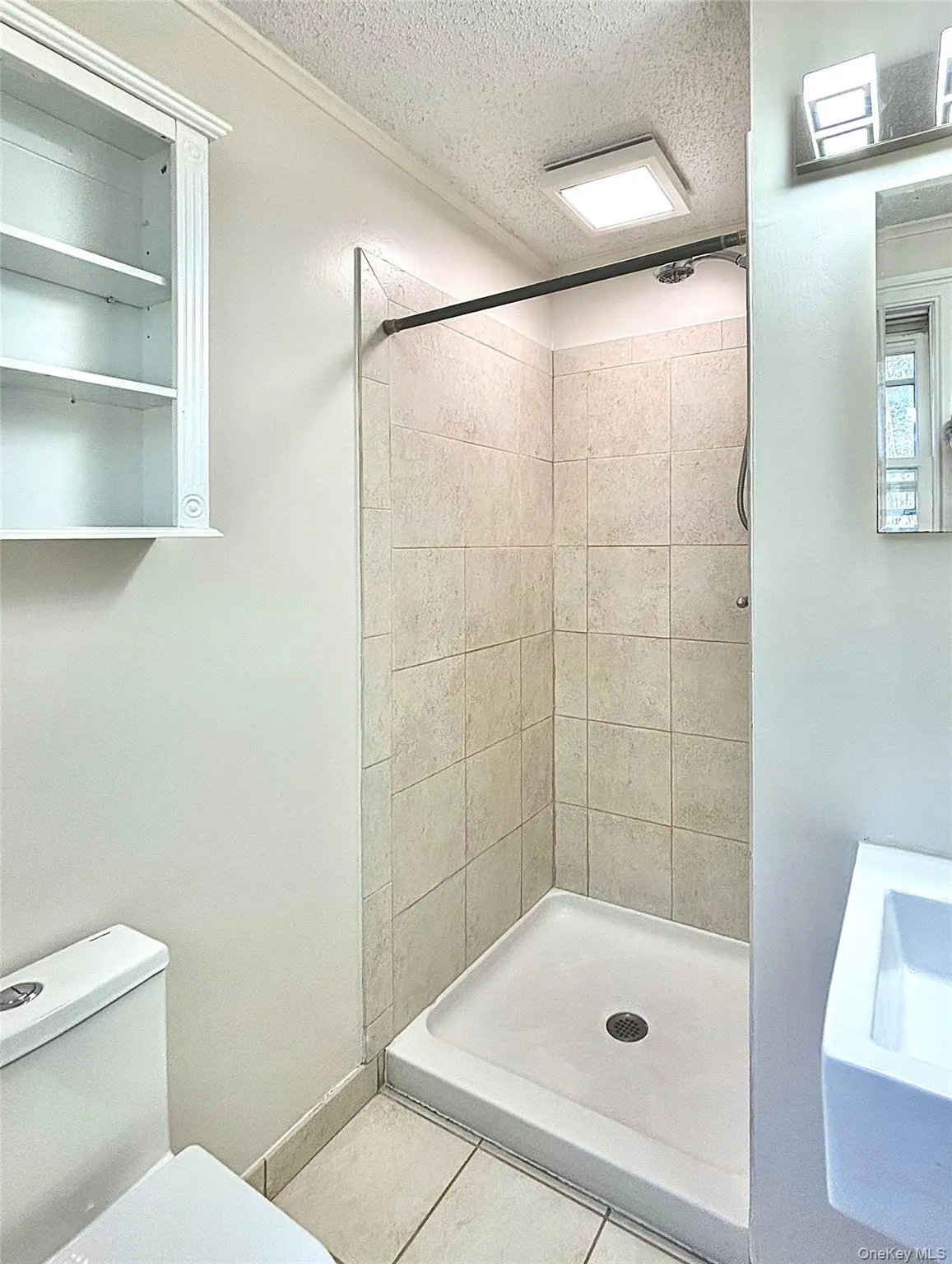 Primary bathroom with ceramic tiled floor and shower Primary bathroom with ceramic tiled floor and shower
