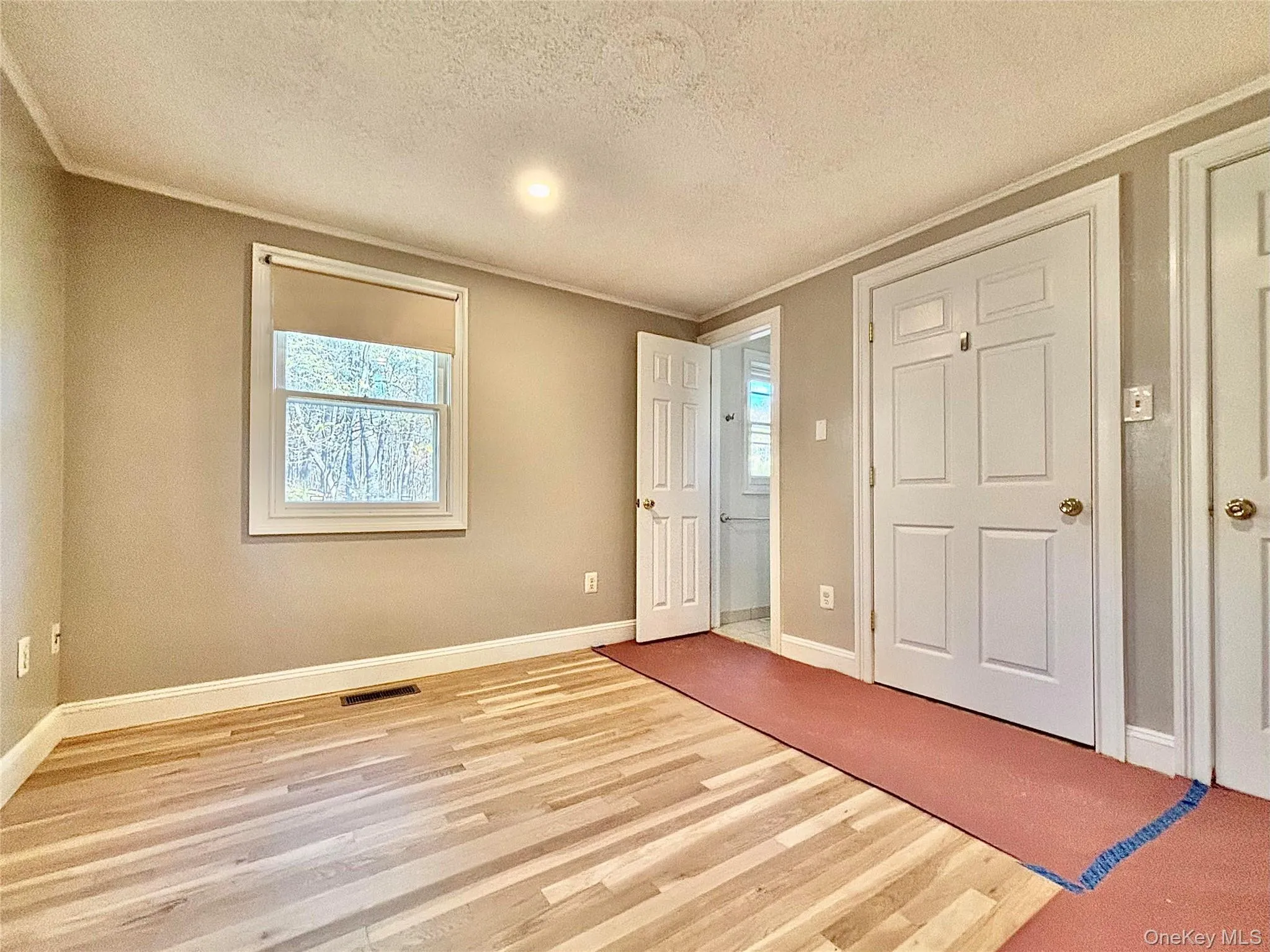 Primary bedroom with beautiful new hard wood floor Primary bedroom with beautiful new hard wood floor