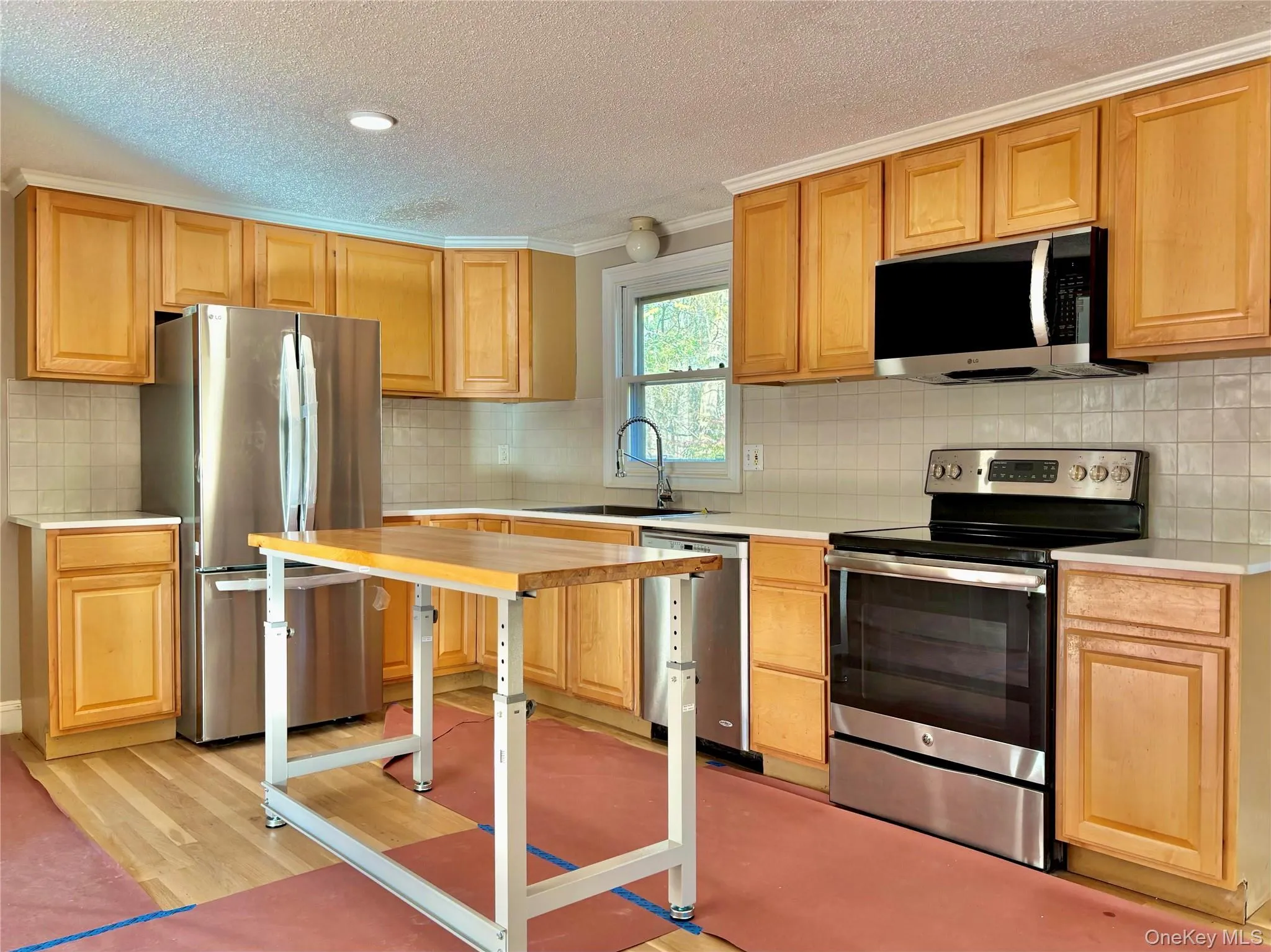 Stainless steel appliances, new refrigerator and microwave Stainless steel appliances, new refrigerator and microwave