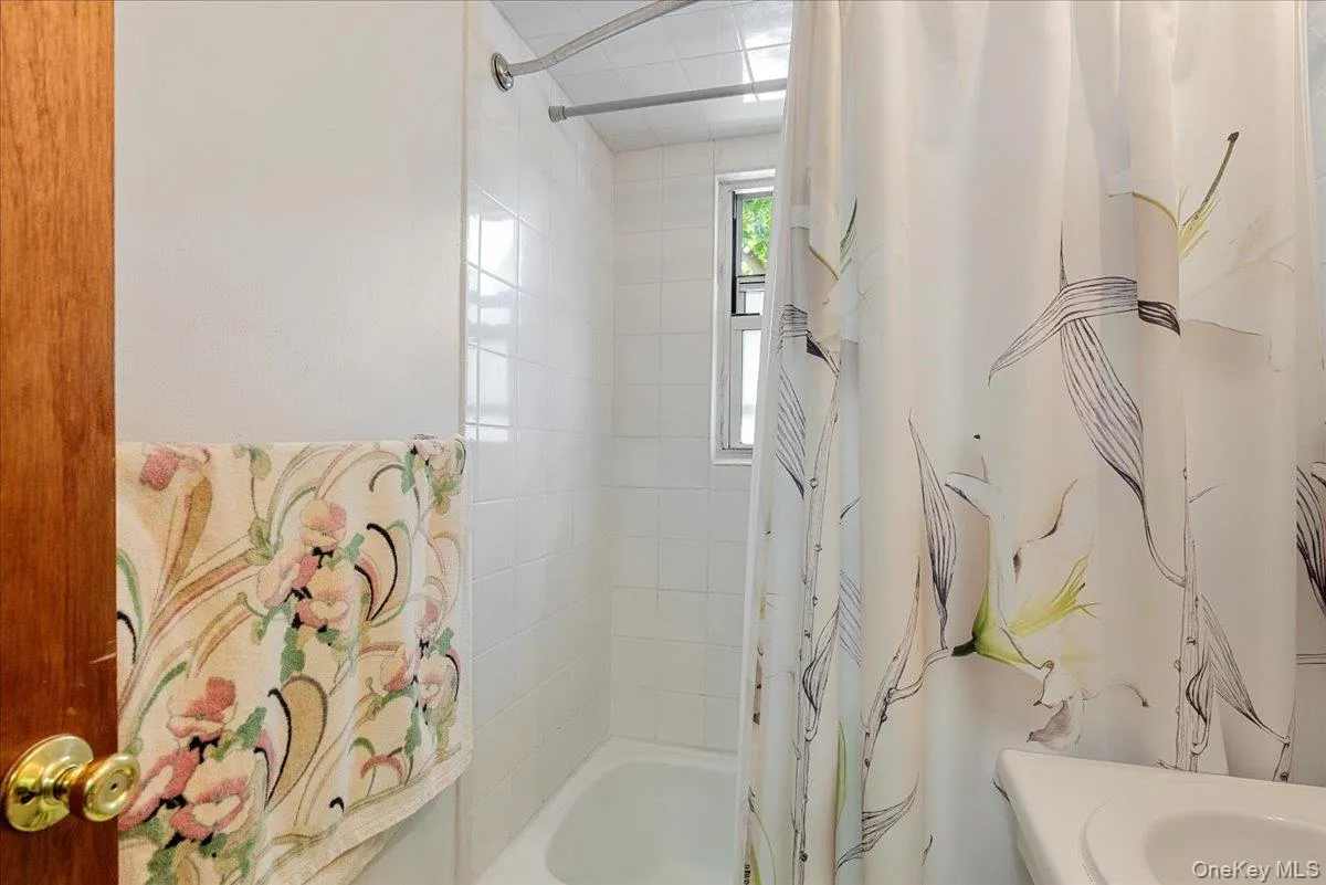 Bathroom with shower / tub combo Bathroom with shower / tub combo