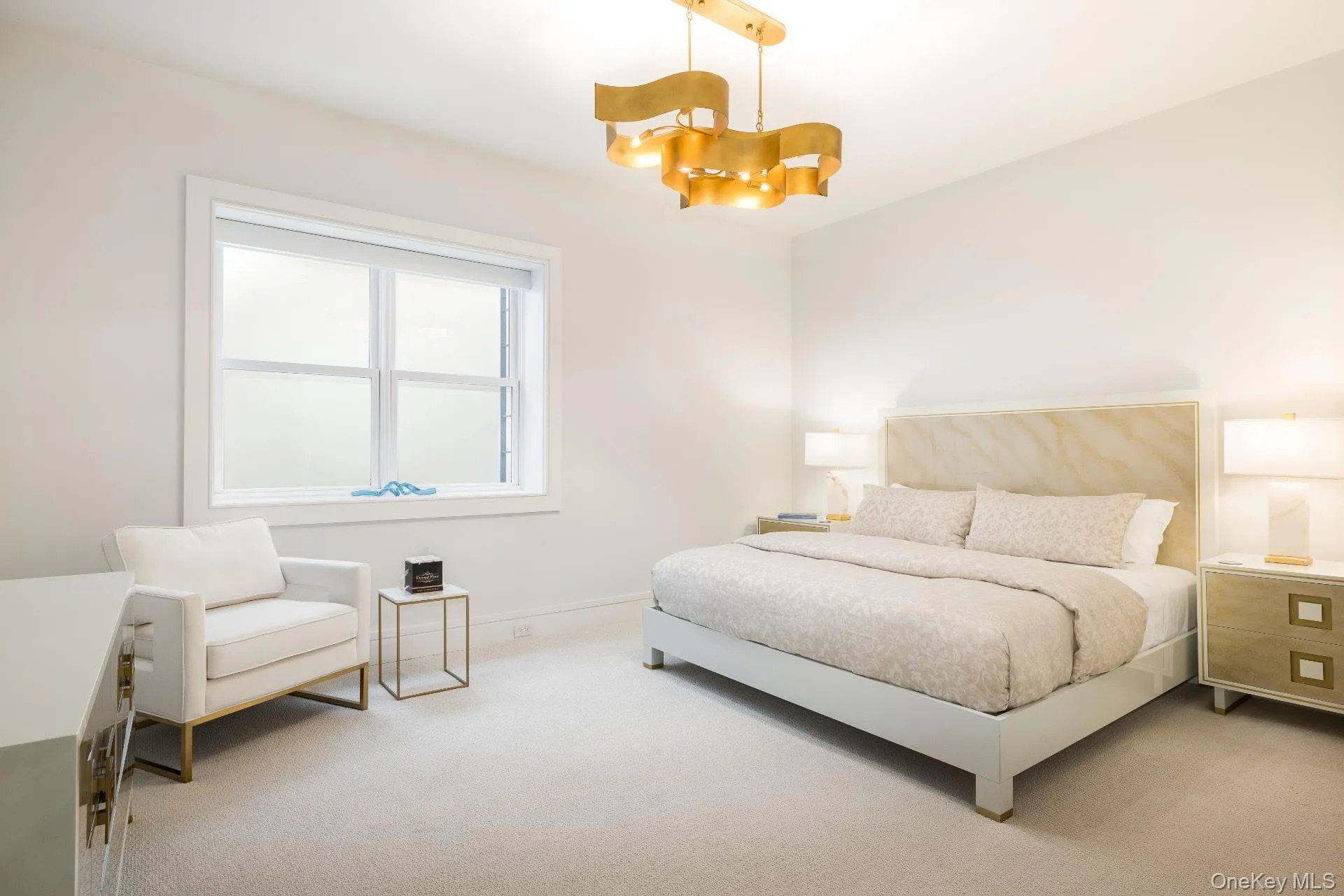 Bedroom featuring carpet floors and a chandelier Bedroom featuring carpet floors and a chandelier