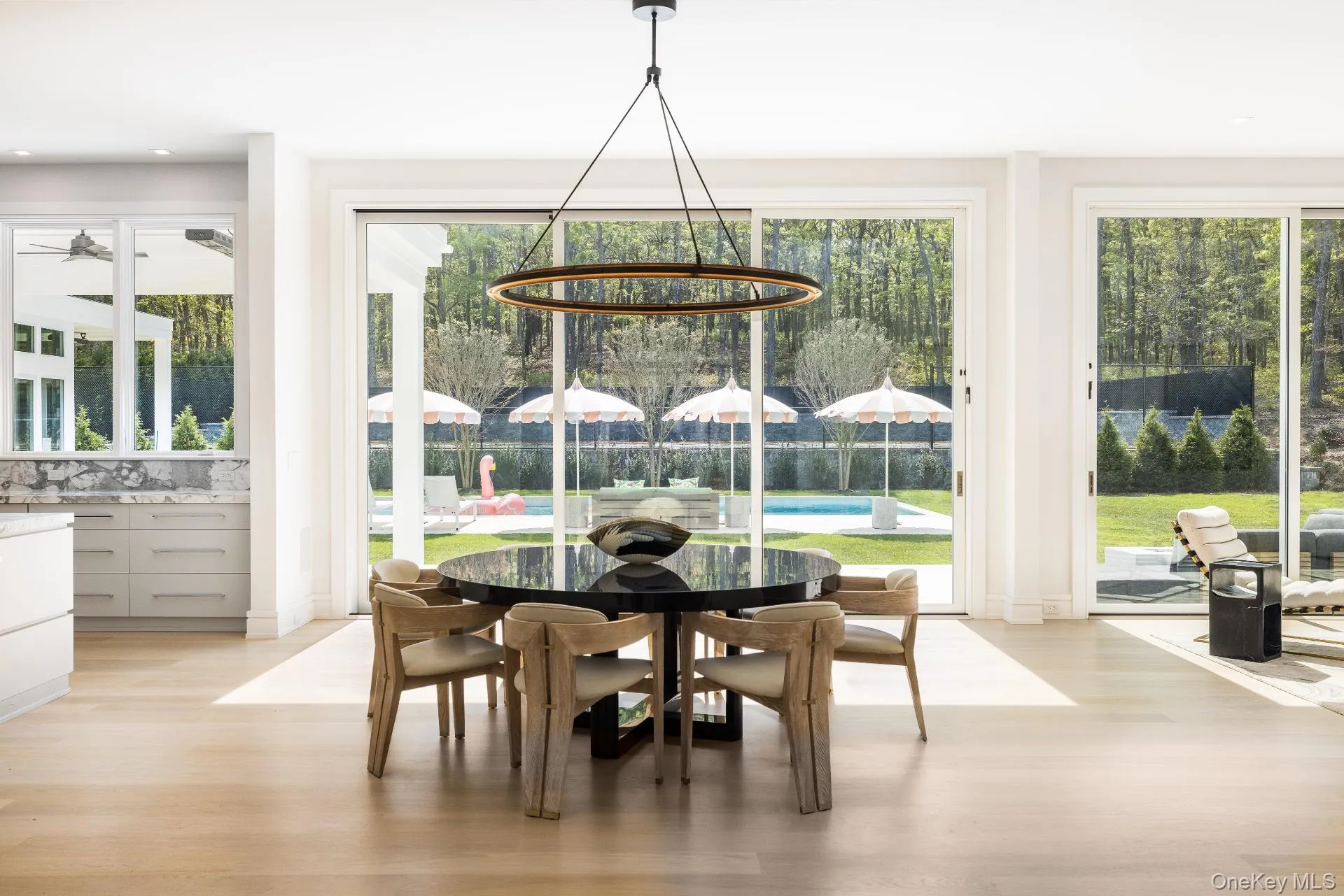 Dining space with light wood-style floors and recessed lighting Dining space with light wood-style floors and recessed lighting