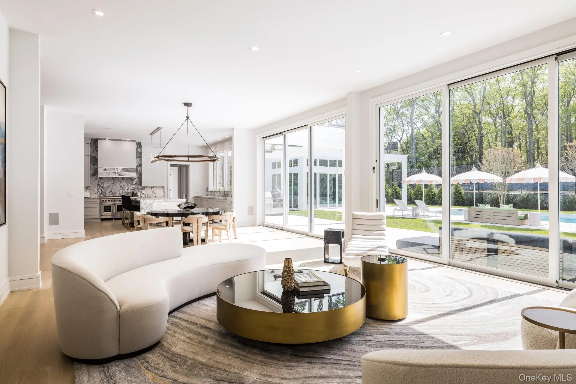 Living room with recessed lighting and light wood-style flooring Living room with recessed lighting and light wood-style flooring