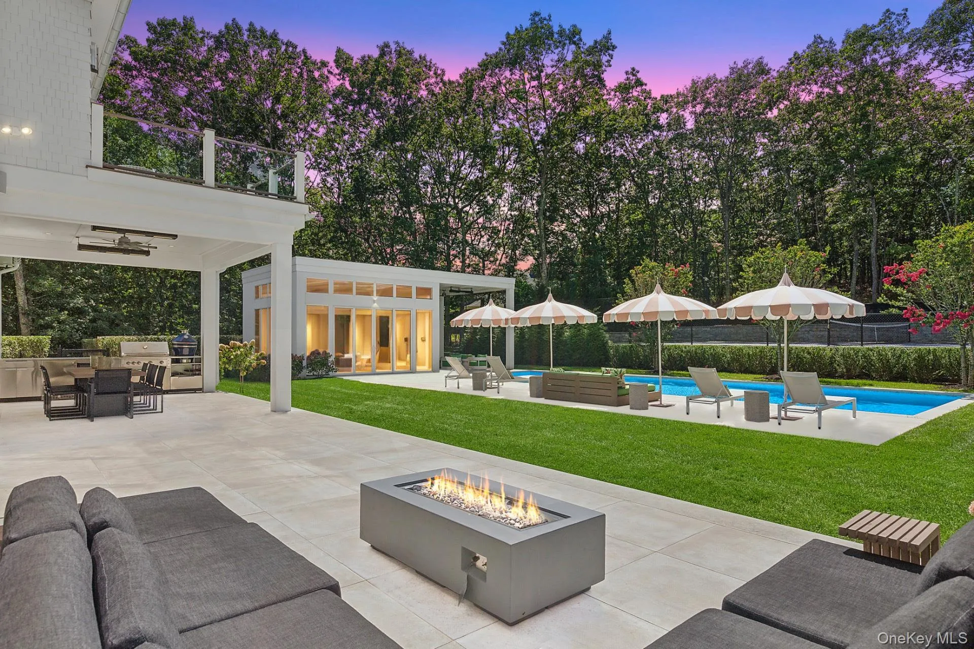 View of patio featuring ceiling fan, outdoor dining area, exterior kitchen, and an outdoor hangout area View of patio featuring ceiling fan, outdoor dining area, exterior kitchen, and an outdoor hangout area