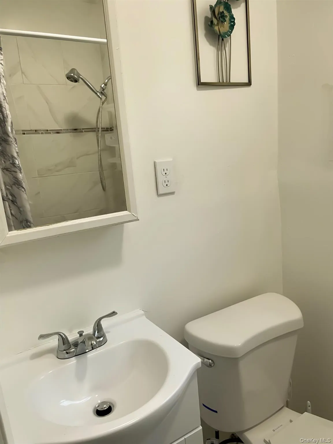 Bathroom with tiled shower and vanity Bathroom with tiled shower and vanity