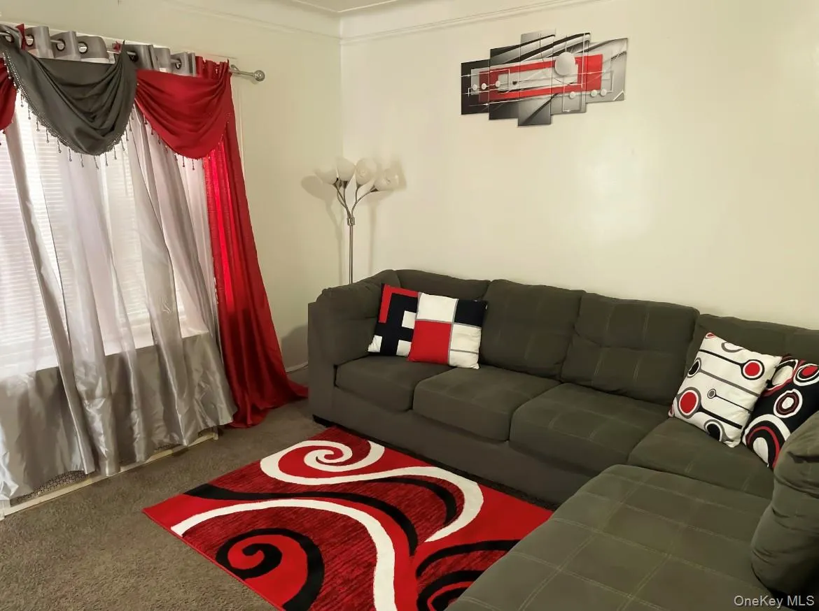 Living area with carpet Living area with carpet