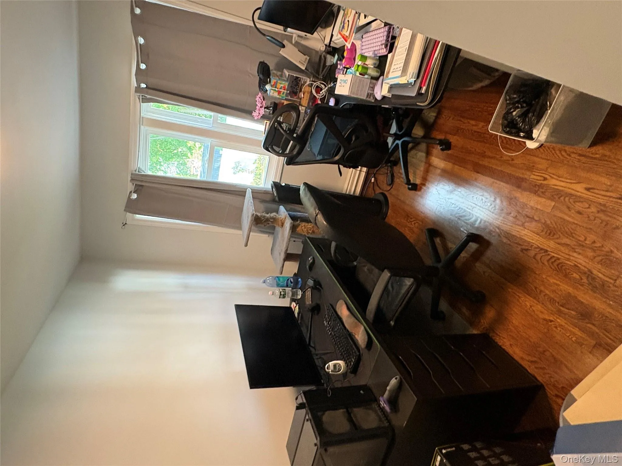 Home office with dark wood-type flooring Home office with dark wood-type flooring