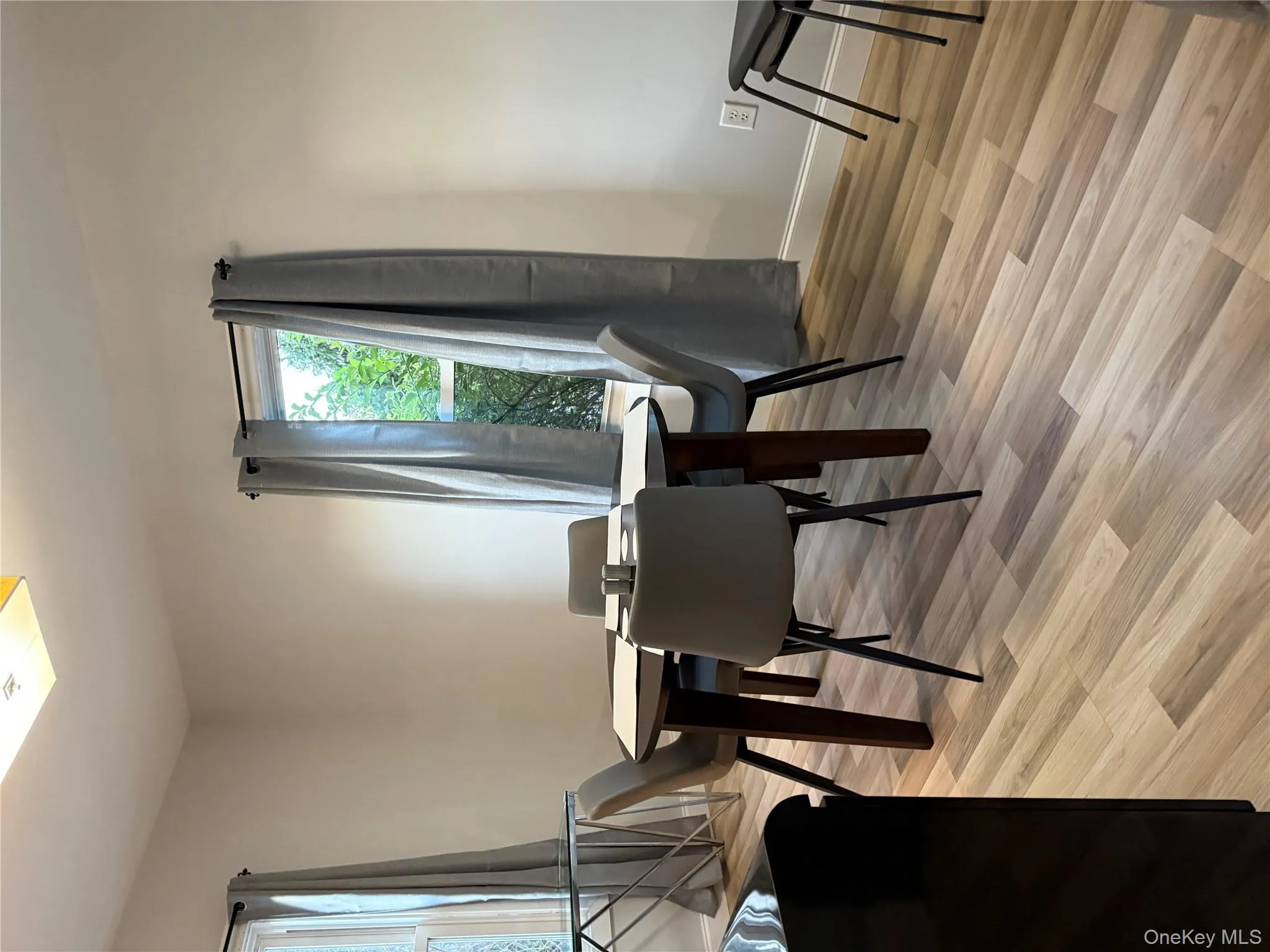 Dining space with light wood-style floors and baseboards Dining space with light wood-style floors and baseboards