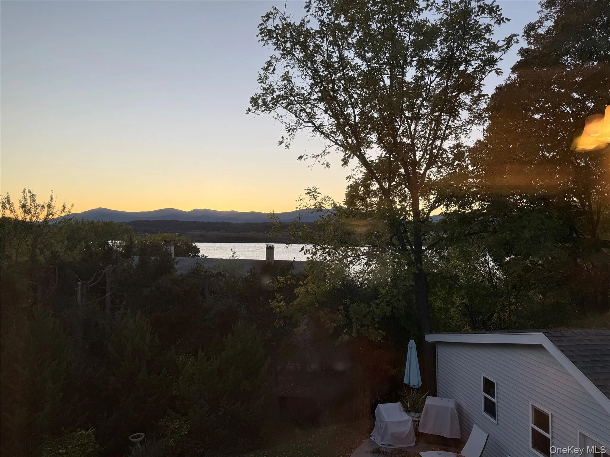 Water view featuring a mountainous background Water view featuring a mountainous background