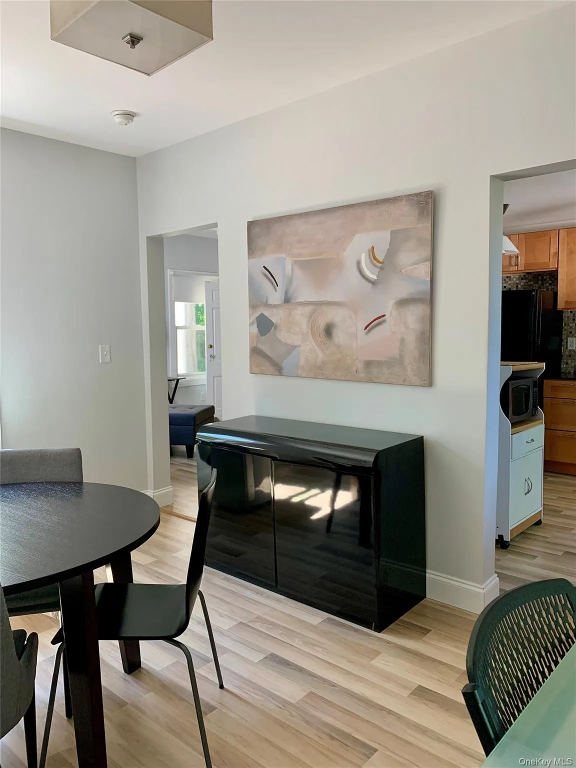 Dining space with light wood-type flooring and baseboards Dining space with light wood-type flooring and baseboards