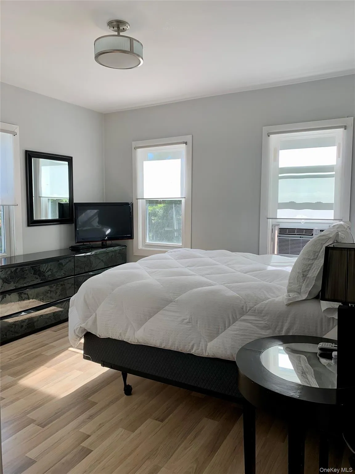Bedroom featuring wood finished floors Bedroom featuring wood finished floors