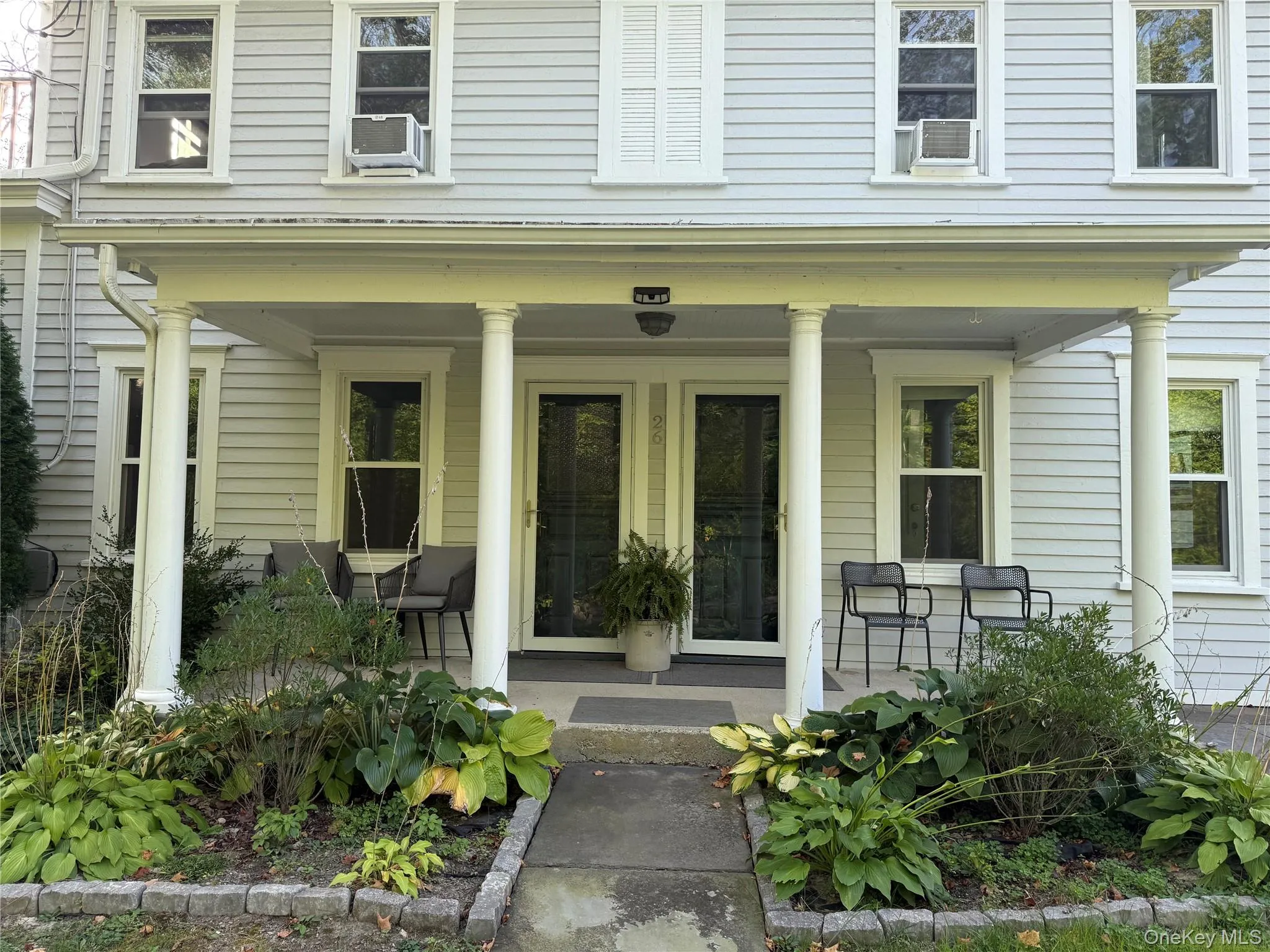 View of exterior entry featuring covered porch View of exterior entry featuring covered porch