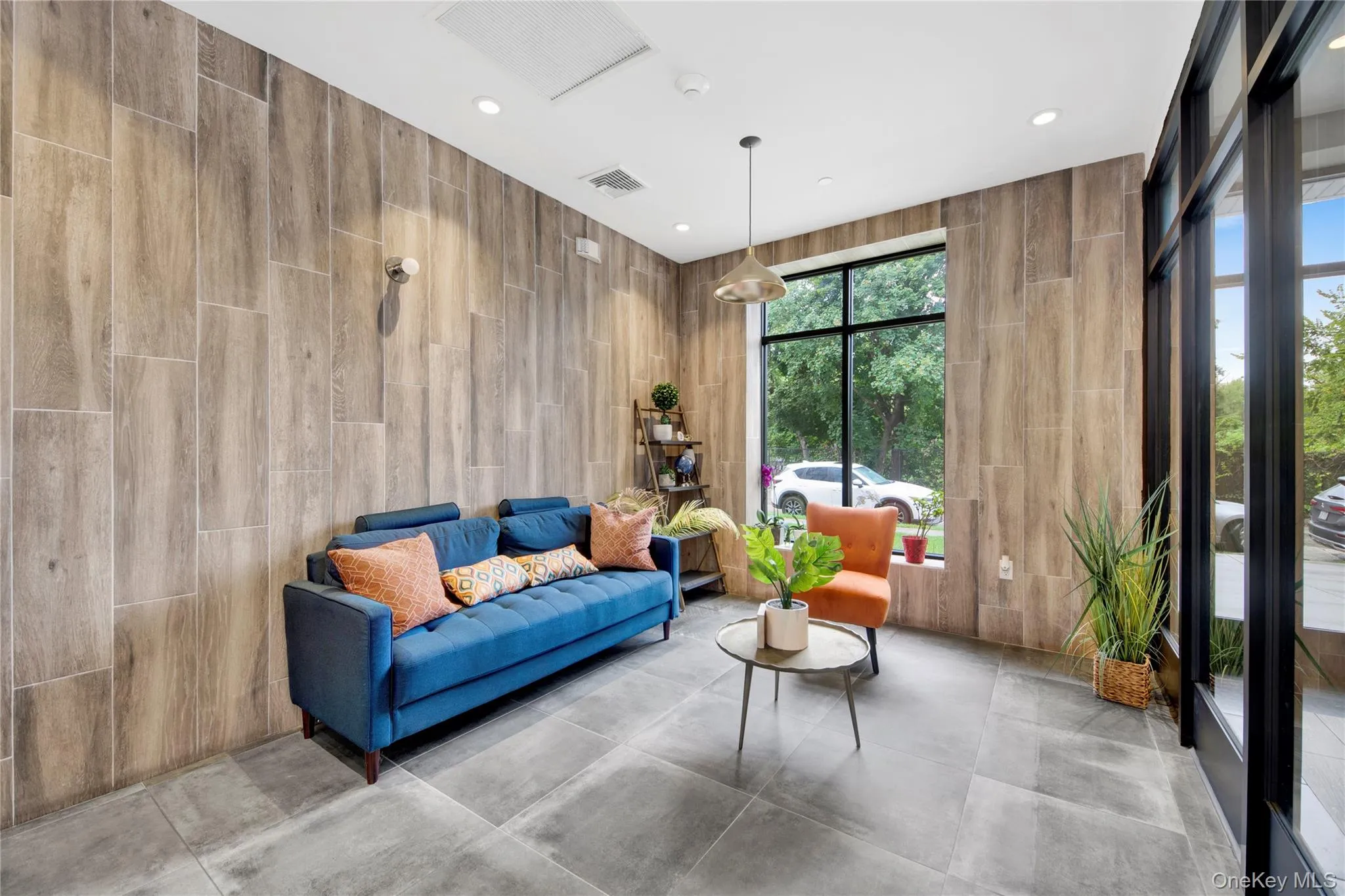 Building lobby featuring recessed lighting Building lobby featuring recessed lighting