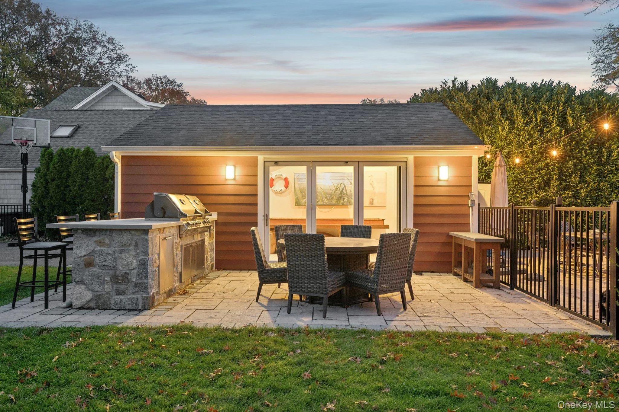 View of patio featuring exterior kitchen and outdoor dining space View of patio featuring exterior kitchen and outdoor dining space