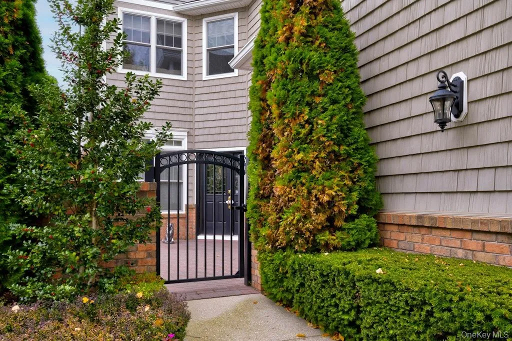 Property entrance with a gate Property entrance with a gate