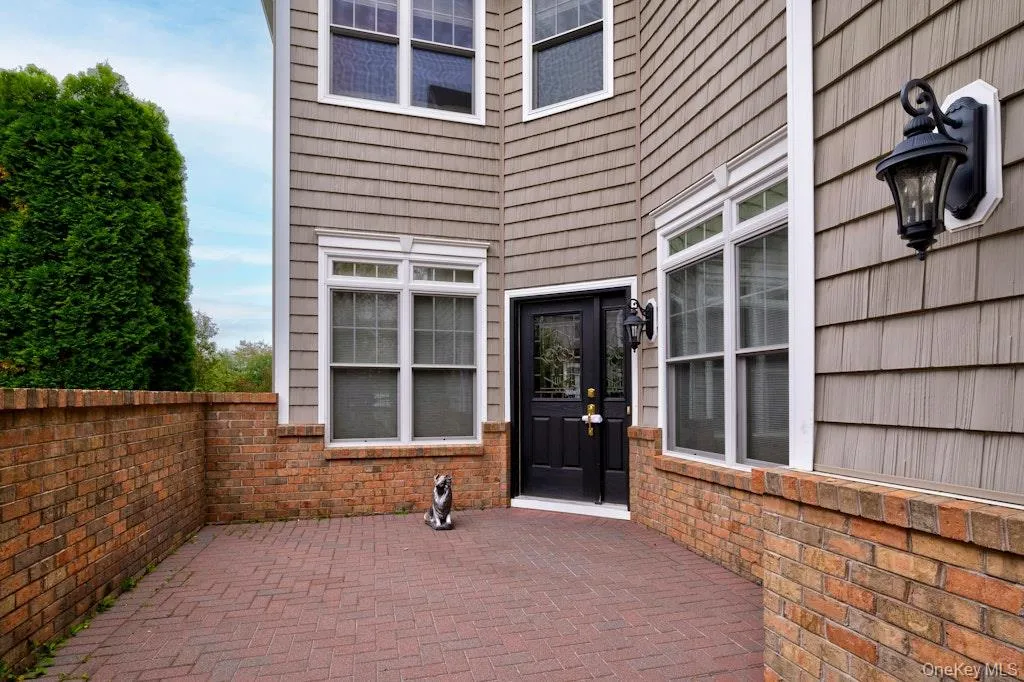 Property entrance featuring a patio area Property entrance featuring a patio area