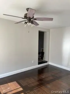 bedroom featuring dark wood-style flooring and a ceiling fan bedroom featuring dark wood-style flooring and a ceiling fan