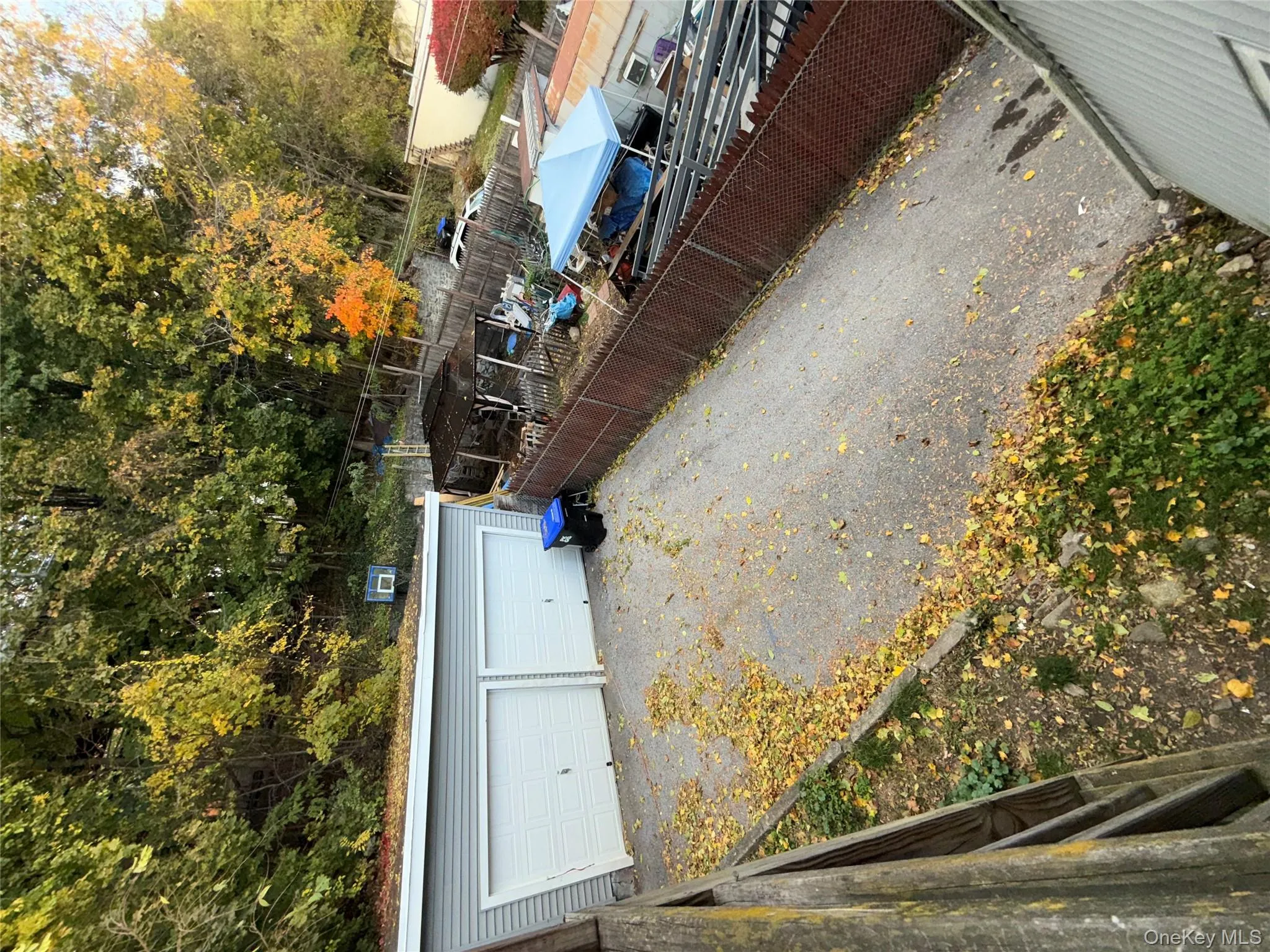 View of patio / terrace featuring an outdoor structure and a garage View of patio / terrace featuring an outdoor structure and a garage