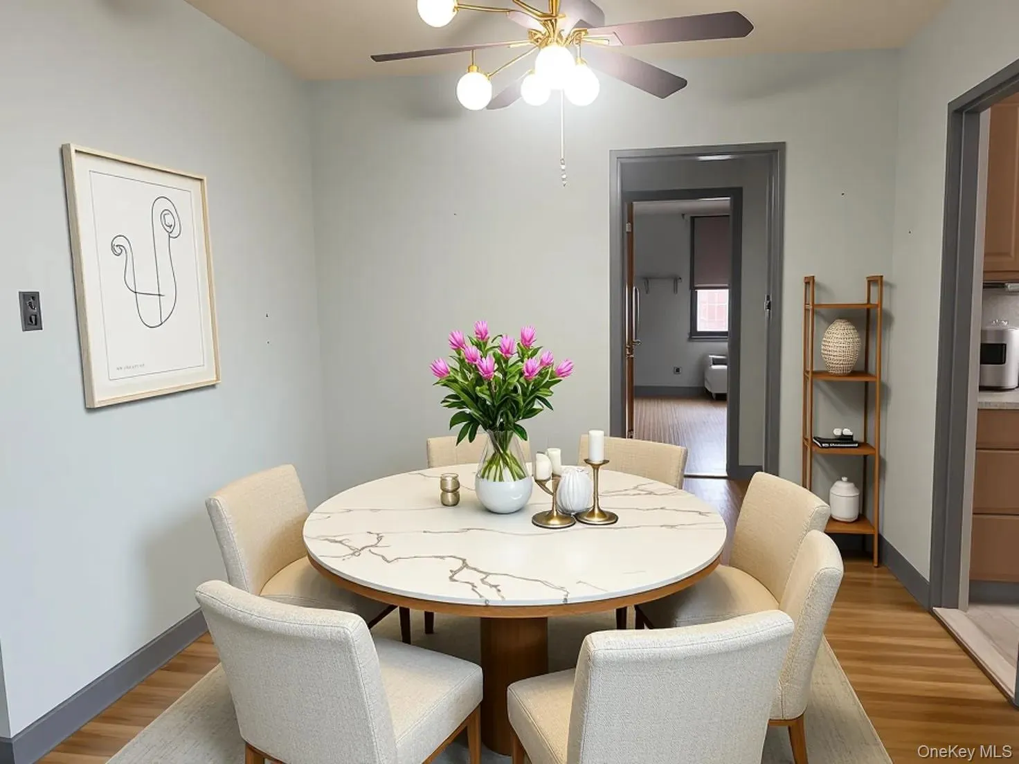 Dining room with light wood finished floors and a ceiling fan Dining room with light wood finished floors and a ceiling fan