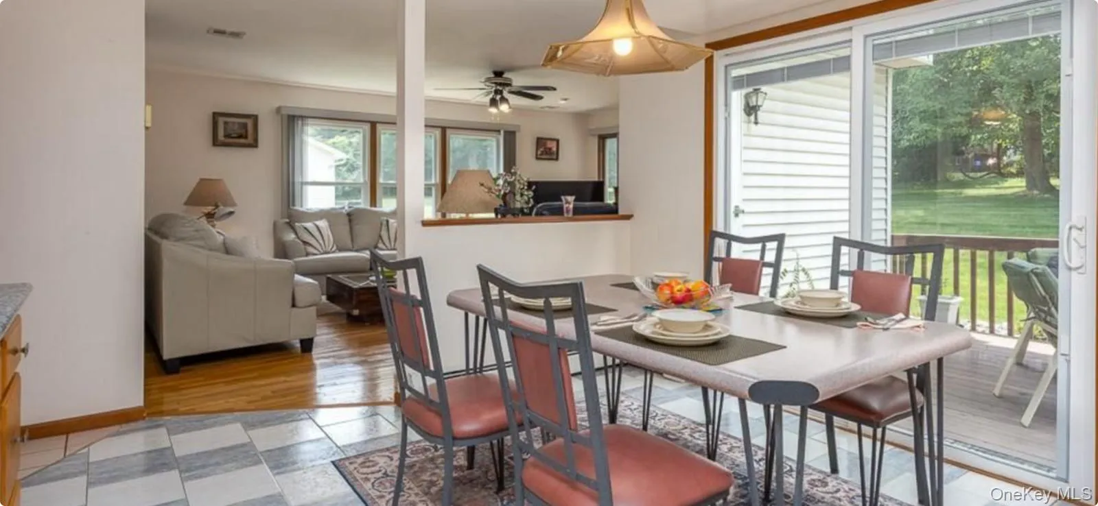 Dining space featuring a ceiling fan and baseboards Dining space featuring a ceiling fan and baseboards