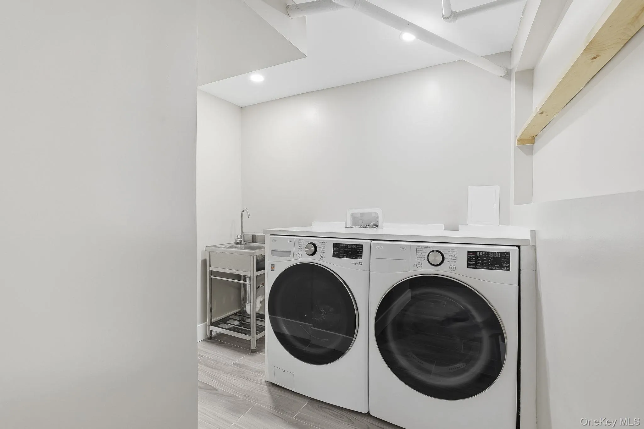 These are the new full-size washer and dryer, with a new stainless steel sink in this laundry room for apartment #1 These are the new full-size washer and dryer, with a new stainless steel sink in this laundry room for apartment #1