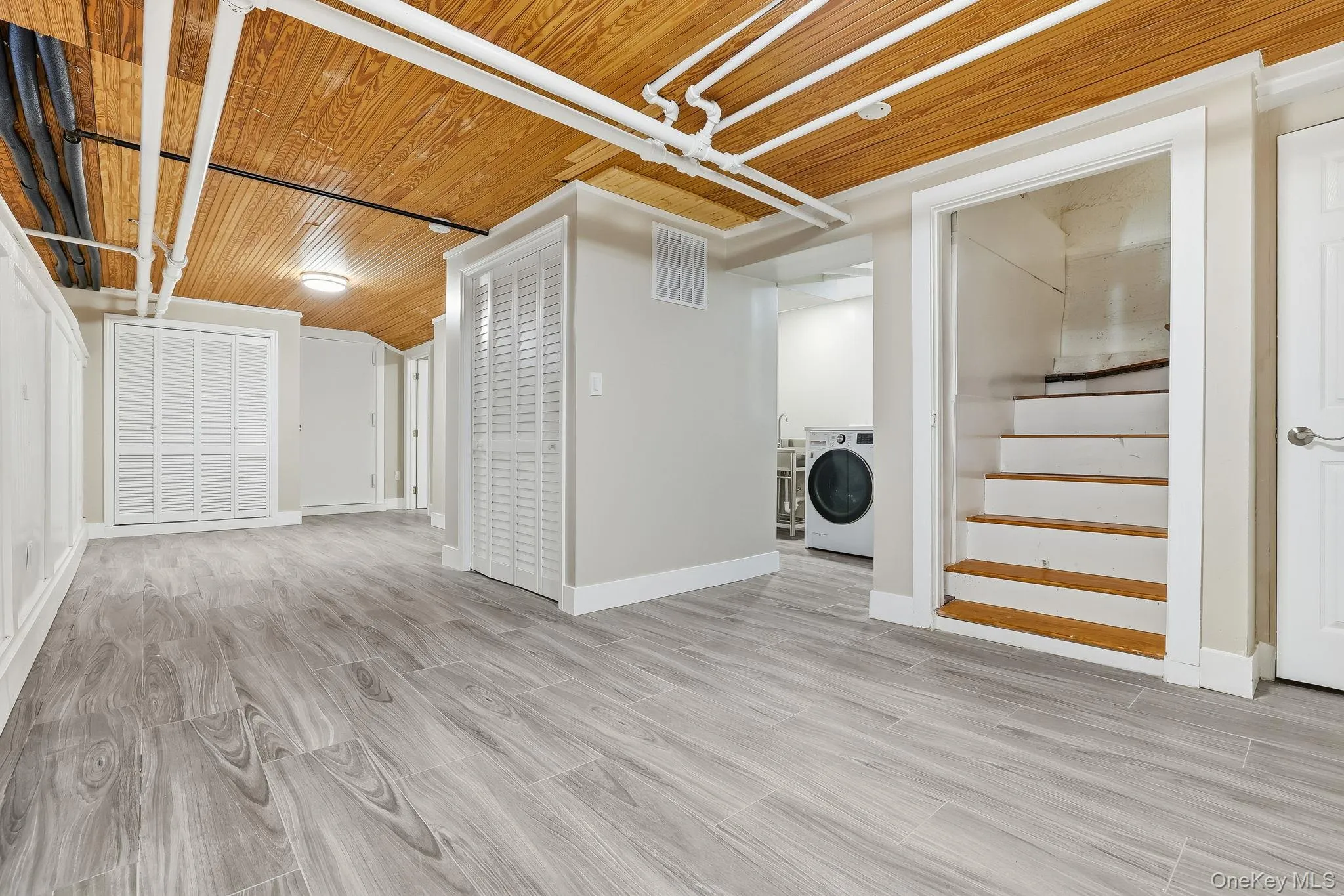 There is a newly finished very large storage area in the lower level with wood-style ceramic flooring and beadboard ceiling finish There is a newly finished very large storage area in the lower level with wood-style ceramic flooring and beadboard ceiling finish