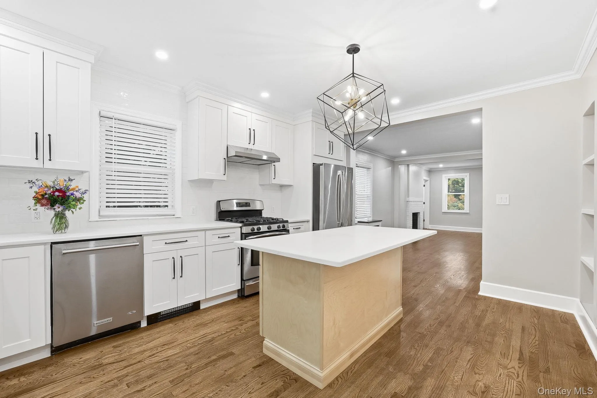 New eat-in kitchen with chandelier over the center island where you can sit and enjoy your morning coffee New eat-in kitchen with chandelier over the center island where you can sit and enjoy your morning coffee