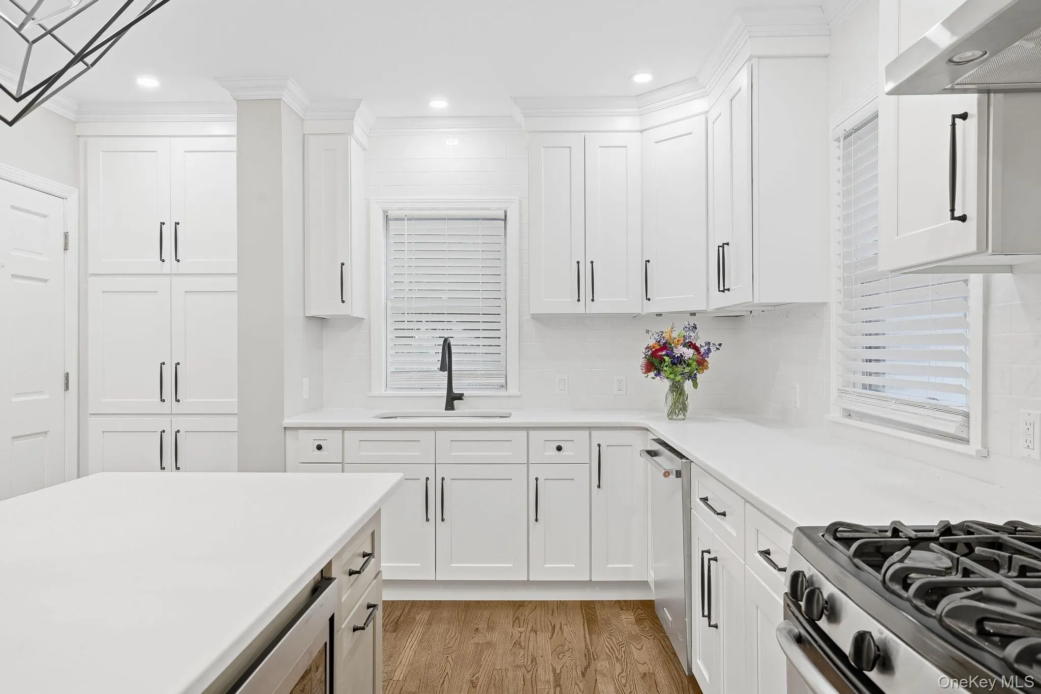 Kitchen features a 5-burner gas range and many full-height cabinets and gorgeous quartz countertops for the chef who moves in Kitchen features a 5-burner gas range and many full-height cabinets and gorgeous quartz countertops for the chef who moves in