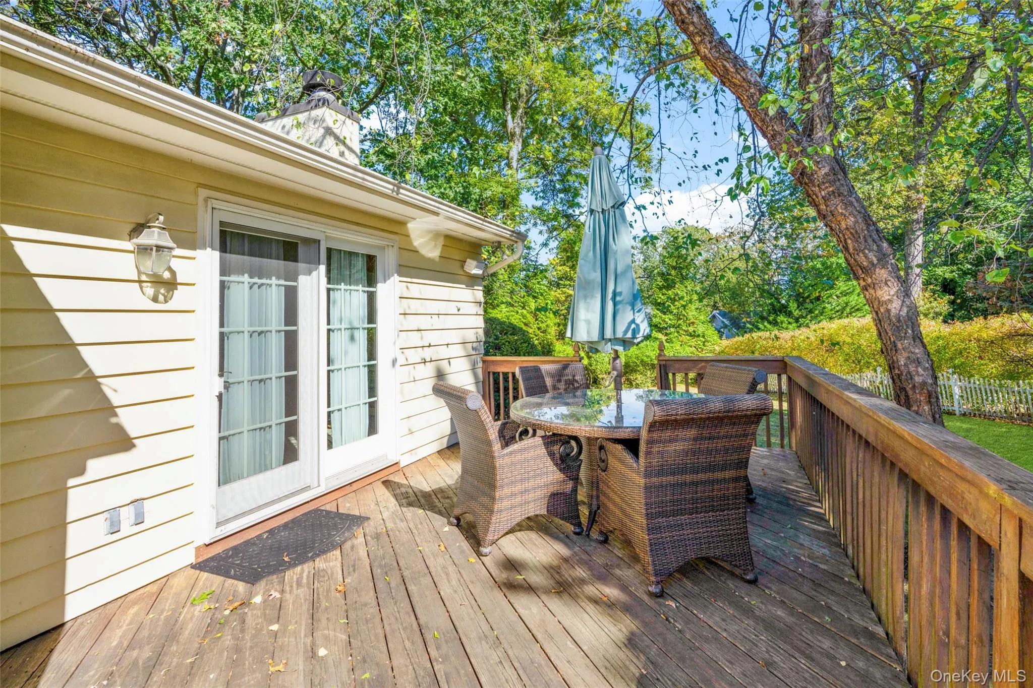 Wooden terrace with outdoor dining area Wooden terrace with outdoor dining area