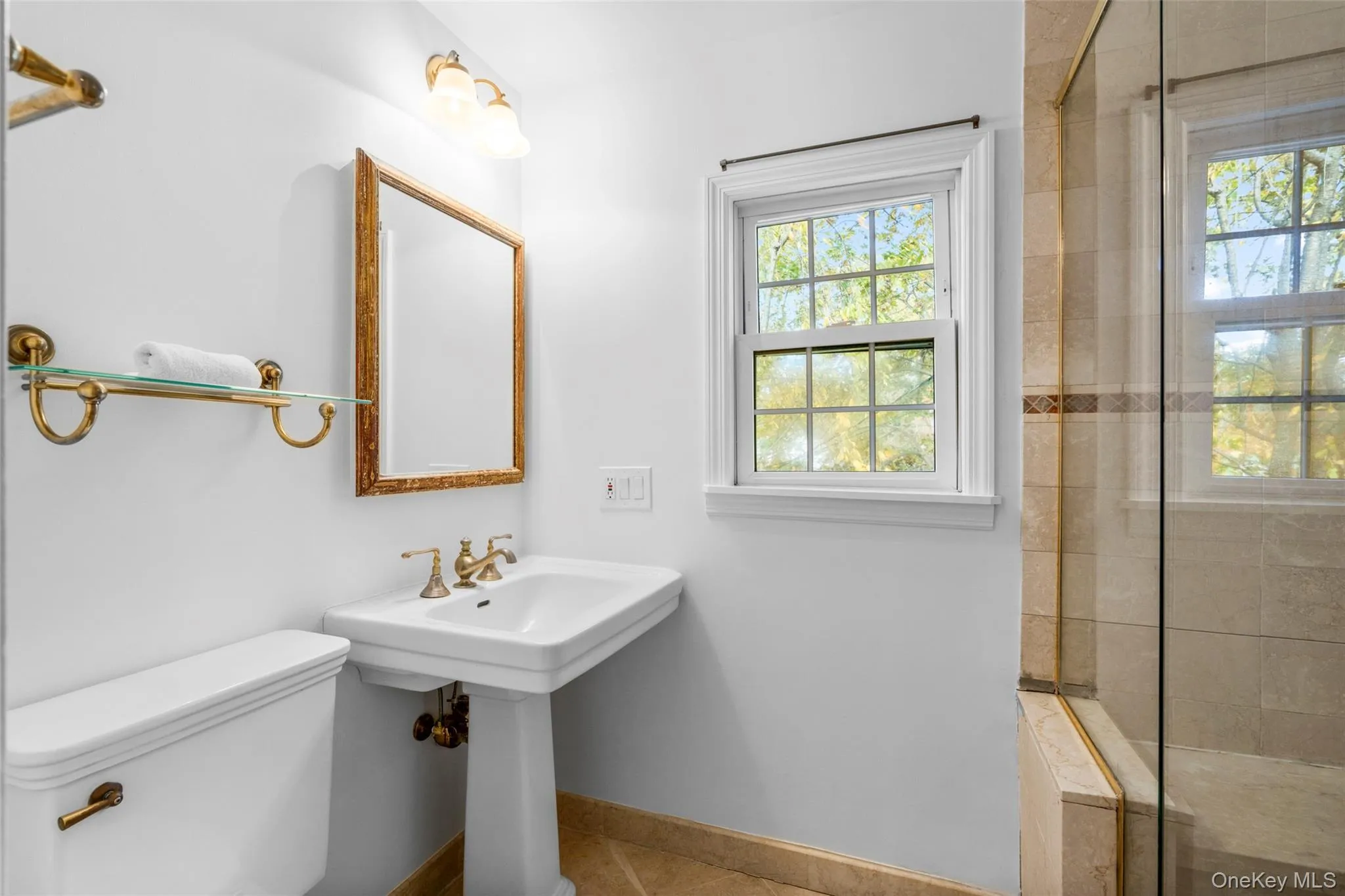 Full bathroom with a stall shower and tile patterned floors Full bathroom with a stall shower and tile patterned floors