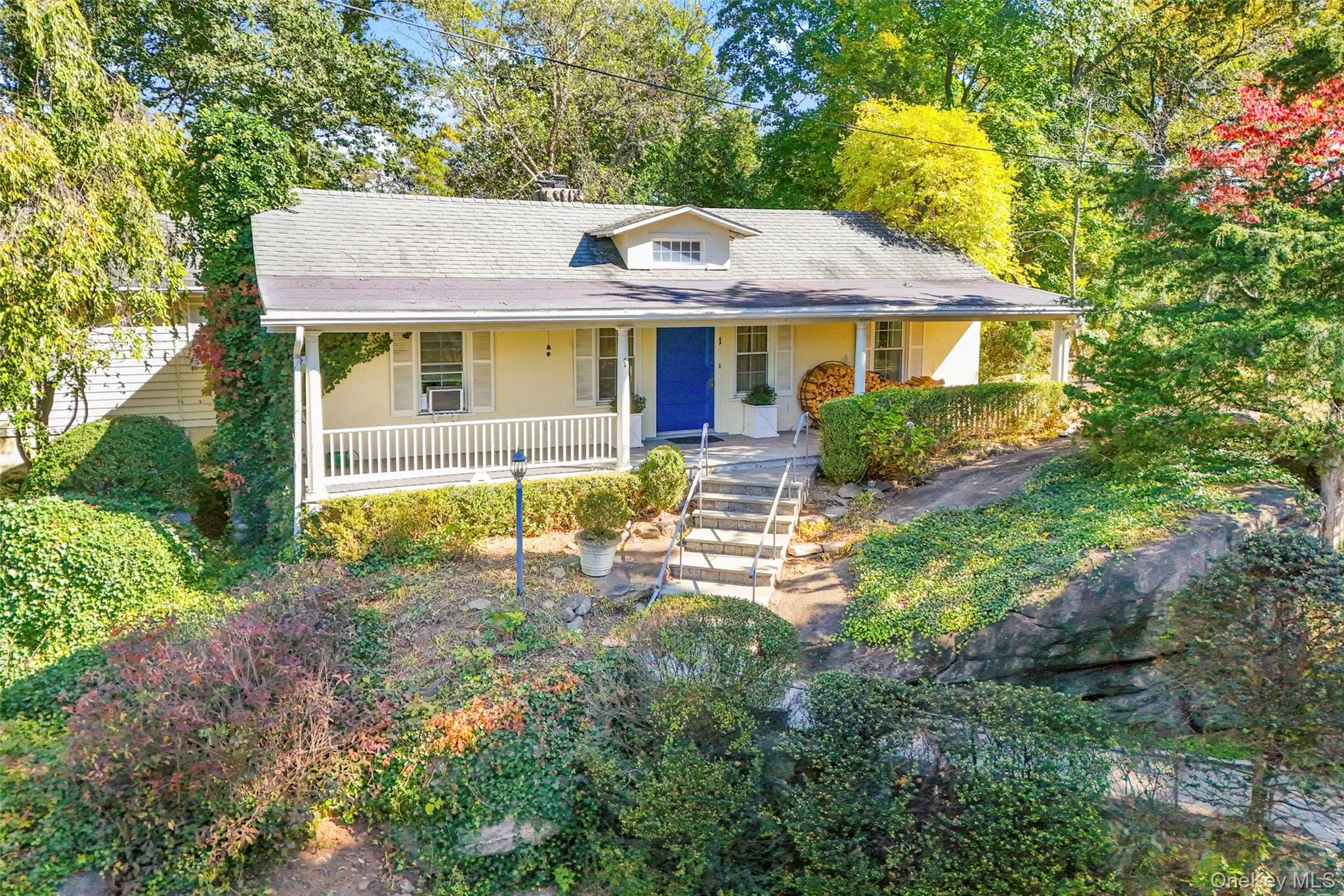 View of front of house featuring covered porch and a shingled roof View of front of house featuring covered porch and a shingled roof