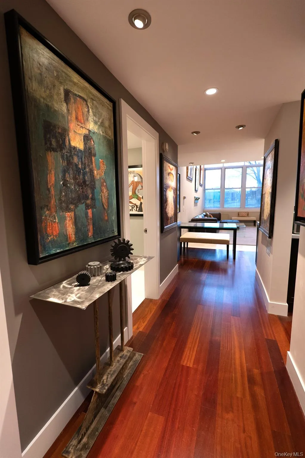 Hall from front entry to kitchen and living room Hall from front entry to kitchen and living room