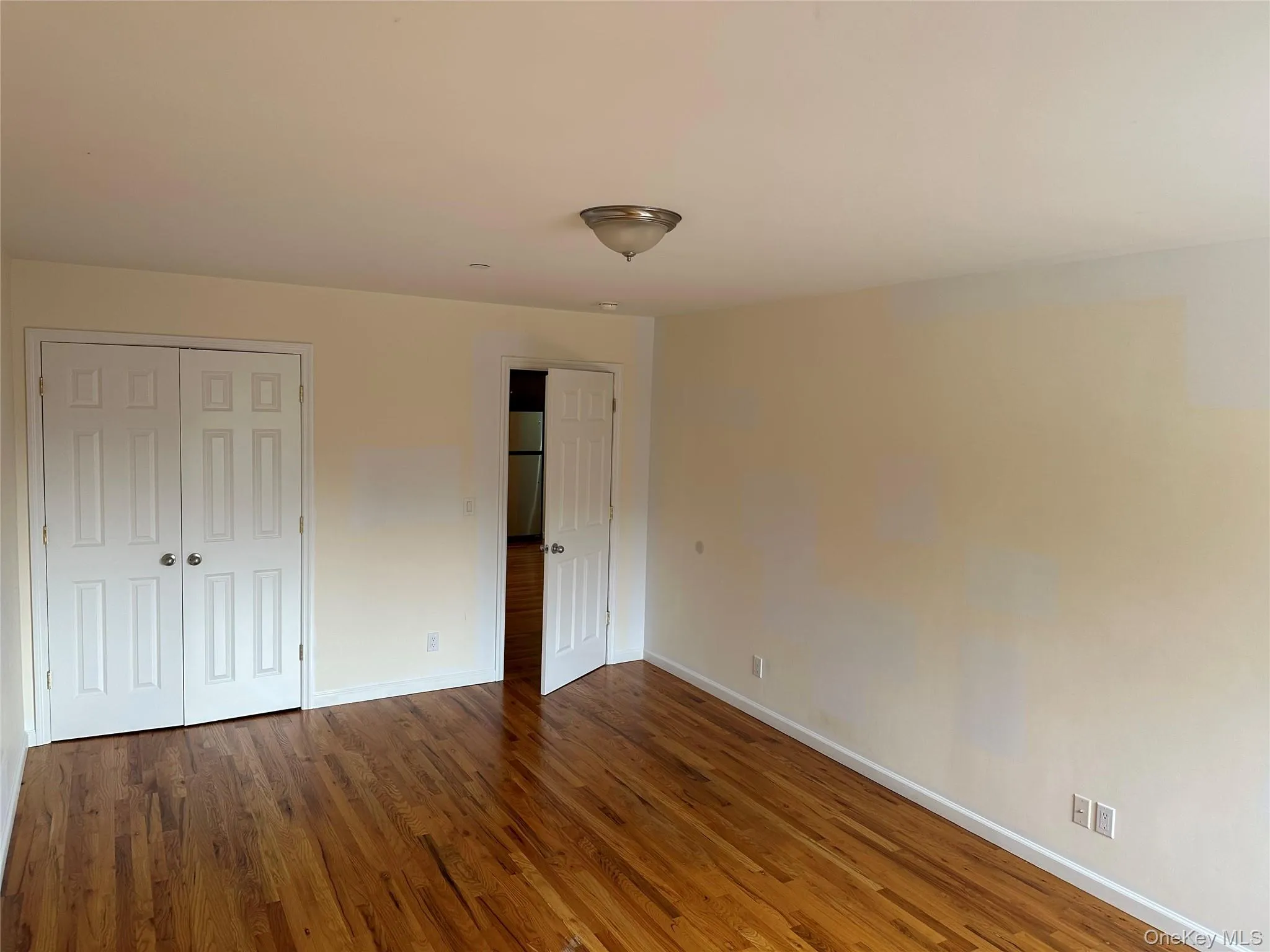 Bedroom featuring hardwood floors. Bedroom featuring hardwood floors.