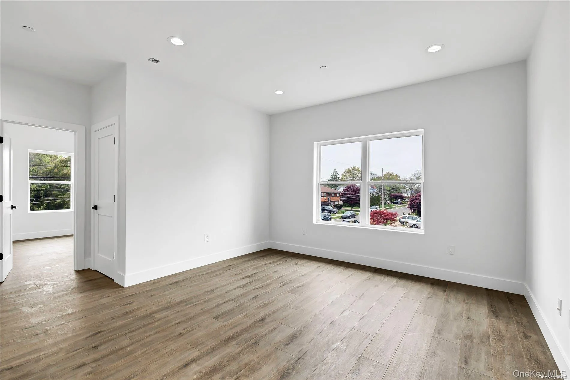 Spare room featuring recessed lighting and light wood-style floors Spare room featuring recessed lighting and light wood-style floors