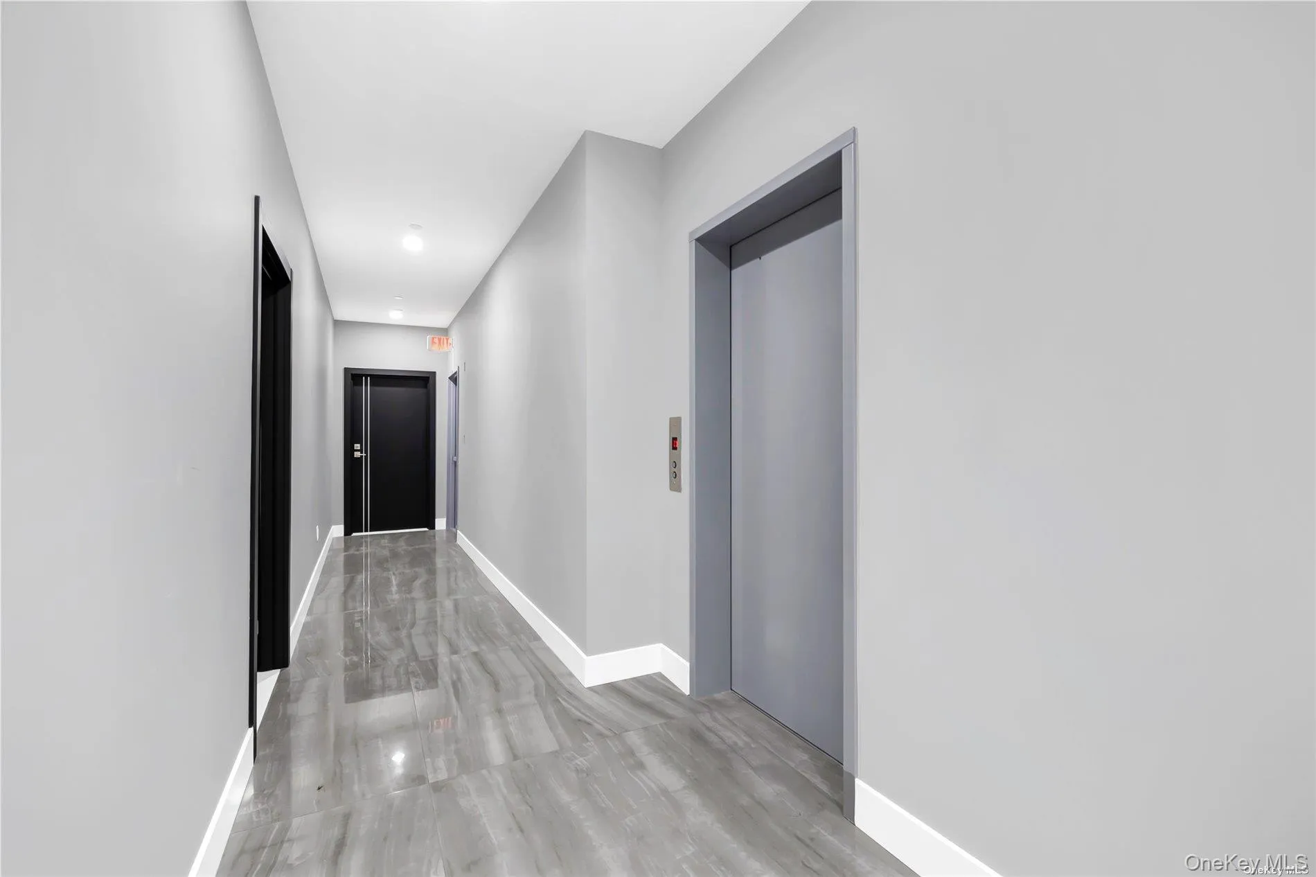 Hall with elevator and recessed lighting Hall with elevator and recessed lighting