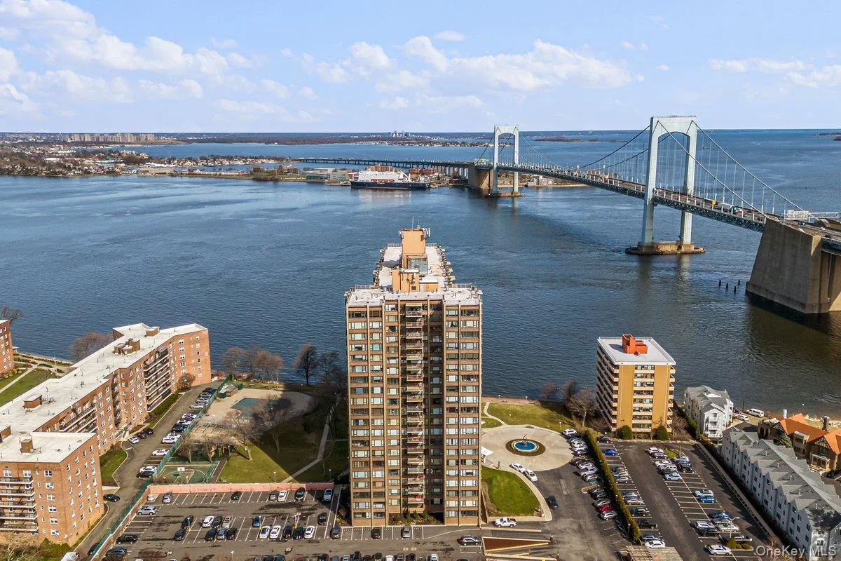 Drone / aerial view of a nearby body of water and a notable bridge Drone / aerial view of a nearby body of water and a notable bridge
