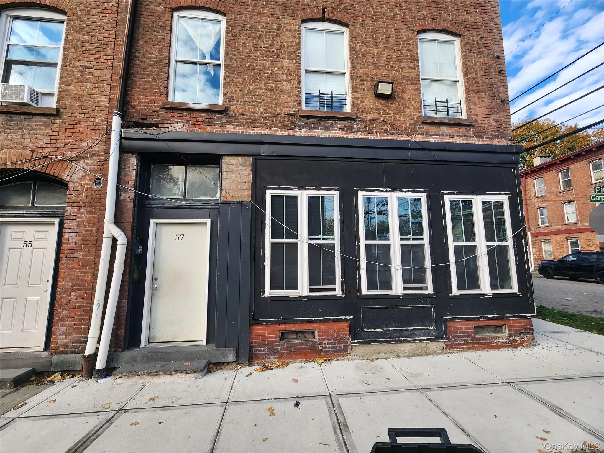 Entrance to property with brick siding and cooling unit Entrance to property with brick siding and cooling unit