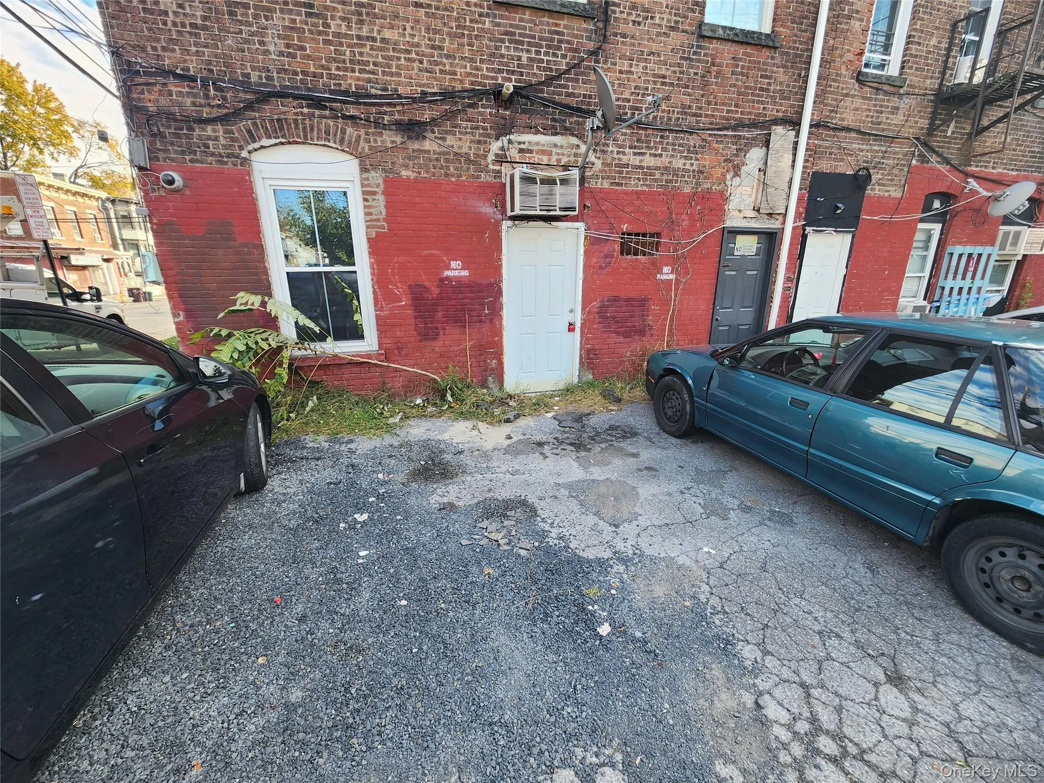 Property entrance featuring brick siding Property entrance featuring brick siding