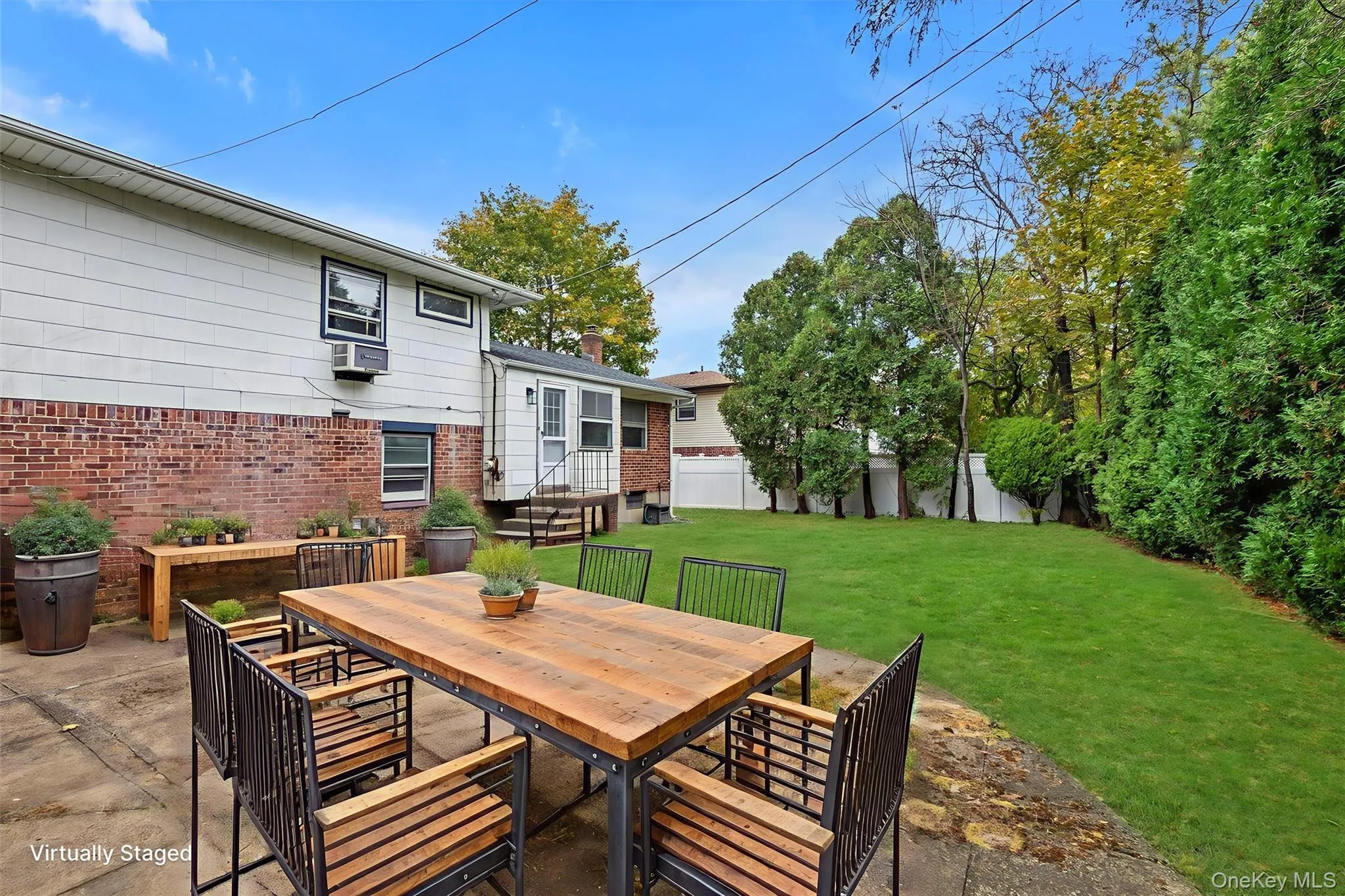 View of patio featuring outdoor dining area View of patio featuring outdoor dining area