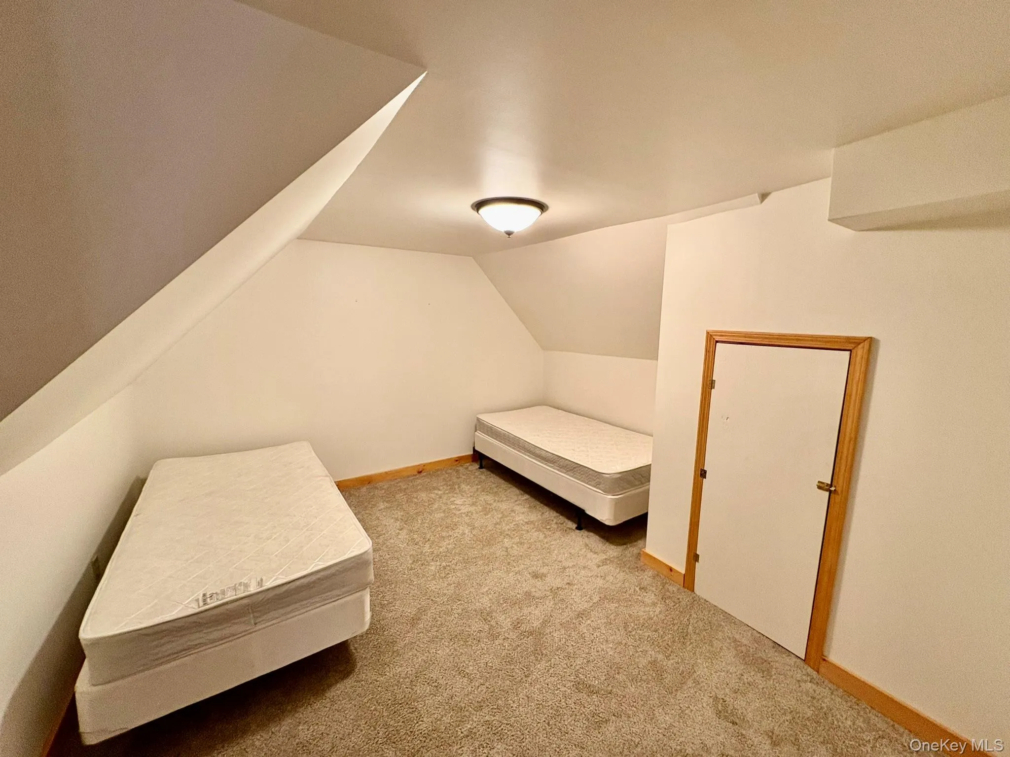 2ND Floor Bedroom with light colored carpet and vaulted ceiling 2ND Floor Bedroom with light colored carpet and vaulted ceiling