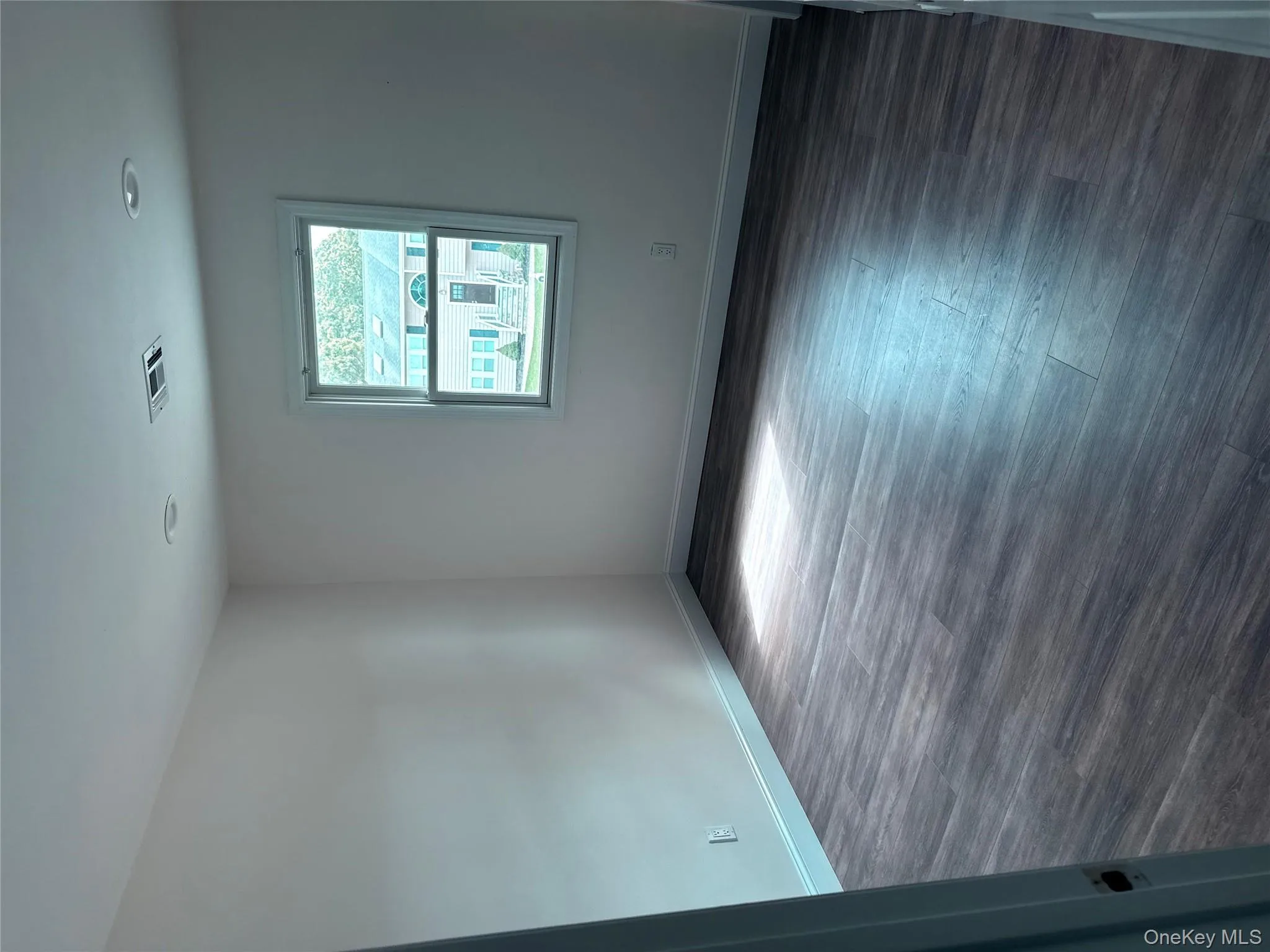 Unfurnished room featuring dark wood finished floors and recessed lighting Unfurnished room featuring dark wood finished floors and recessed lighting