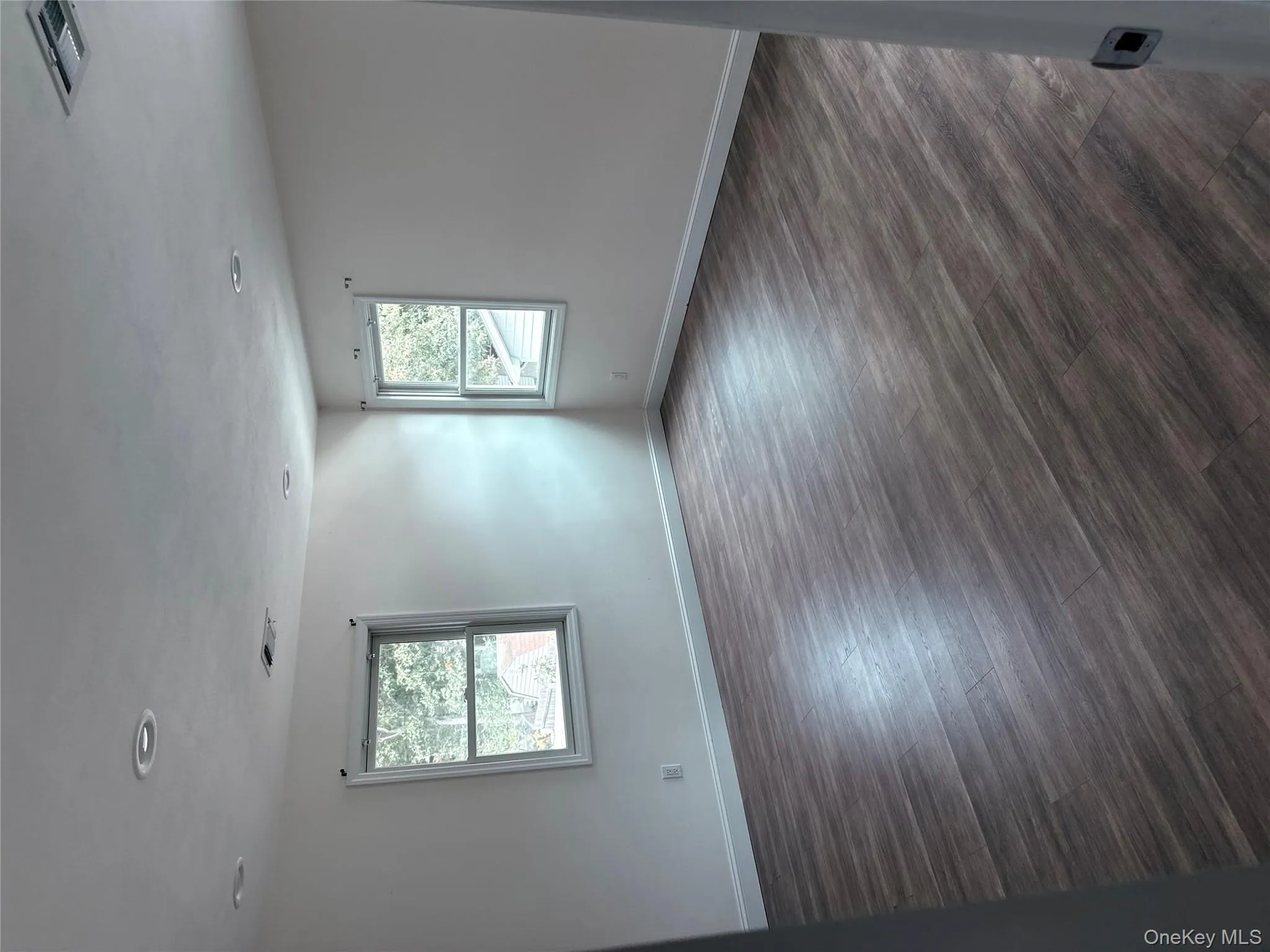 Spare room featuring dark wood-style floors and recessed lighting Spare room featuring dark wood-style floors and recessed lighting