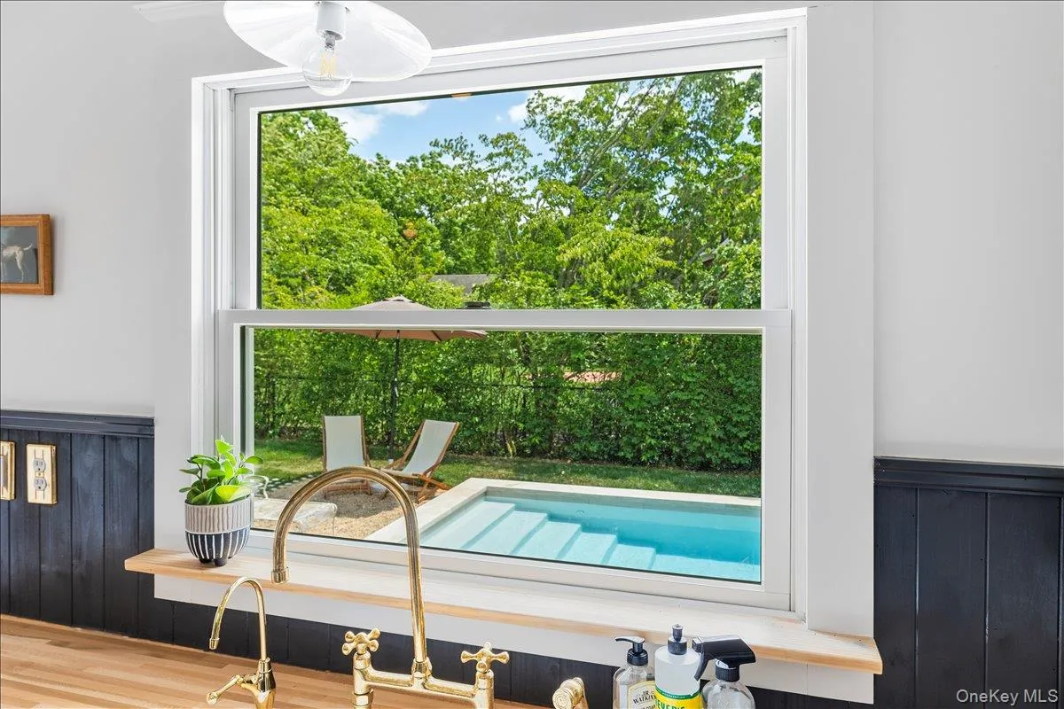 View of swimming pool featuring a sink View of swimming pool featuring a sink