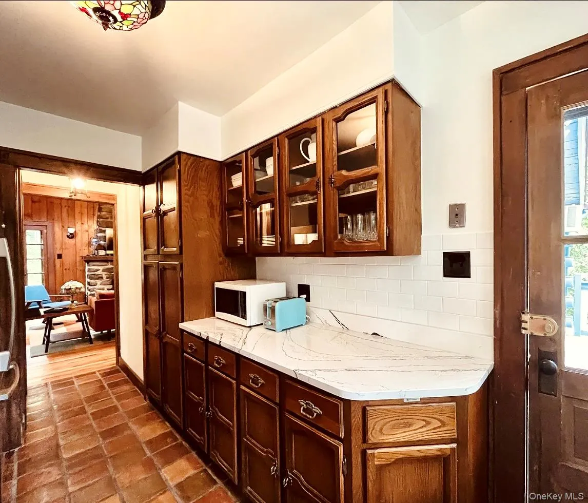 Newly updated kitchen featuring a gas stove, dishwasher, and full-size refrigerator. Newly updated kitchen featuring a gas stove, dishwasher, and full-size refrigerator.