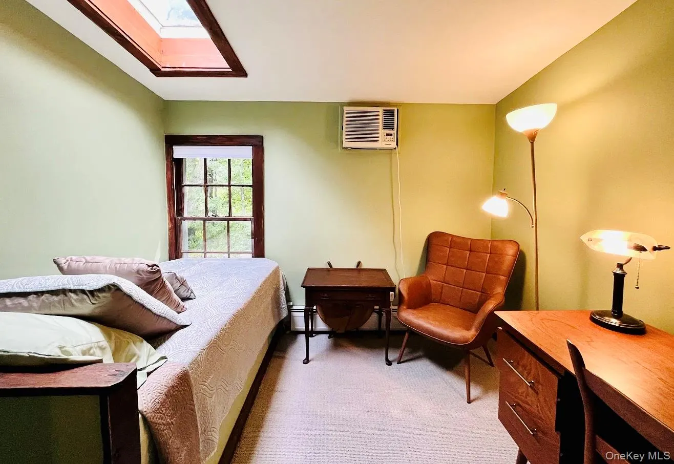 Second bedroom with a twin bed, leading to the laundry area. Second bedroom with a twin bed, leading to the laundry area.