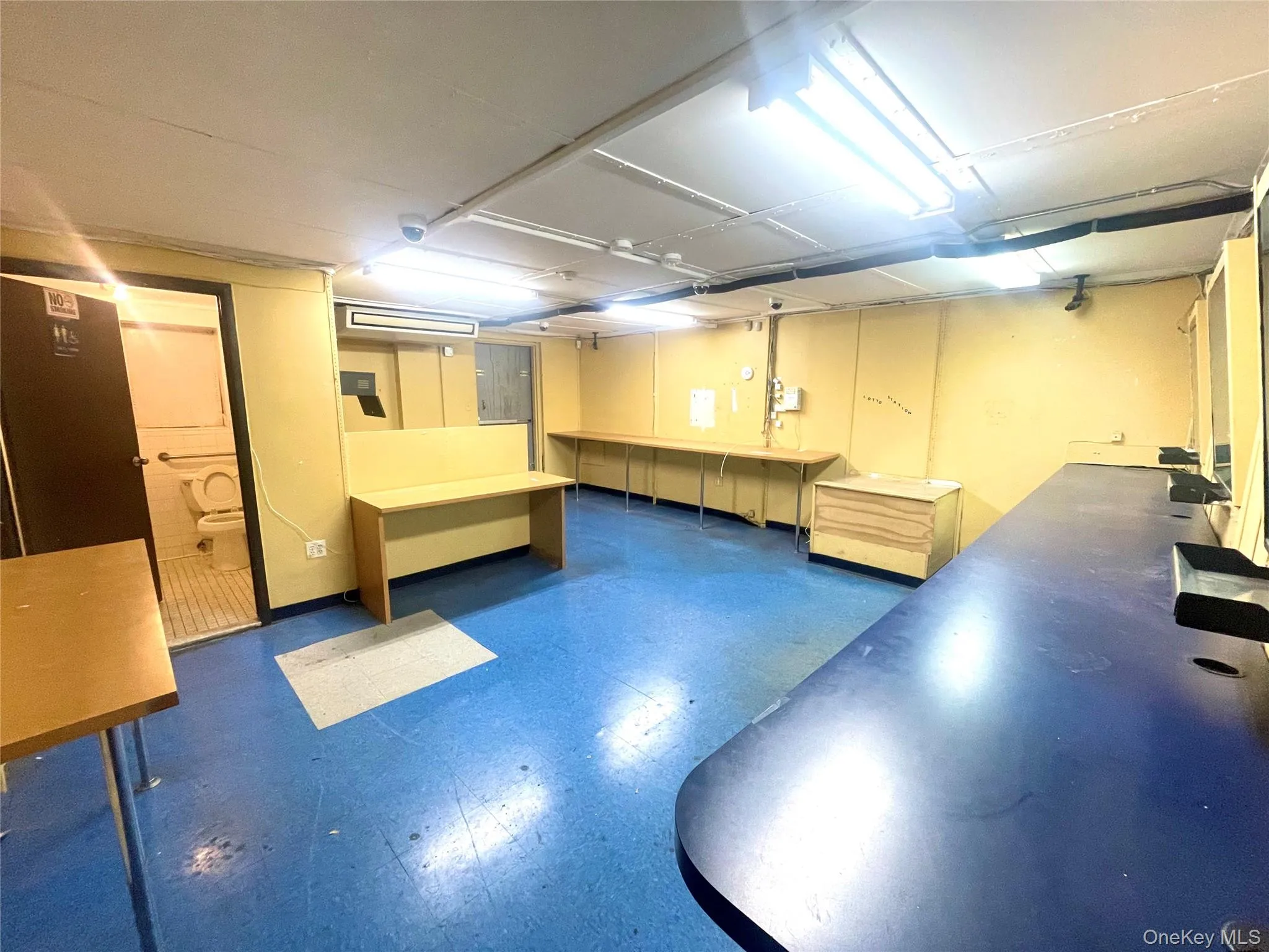 Below grade area with dark flooring Below grade area with dark flooring