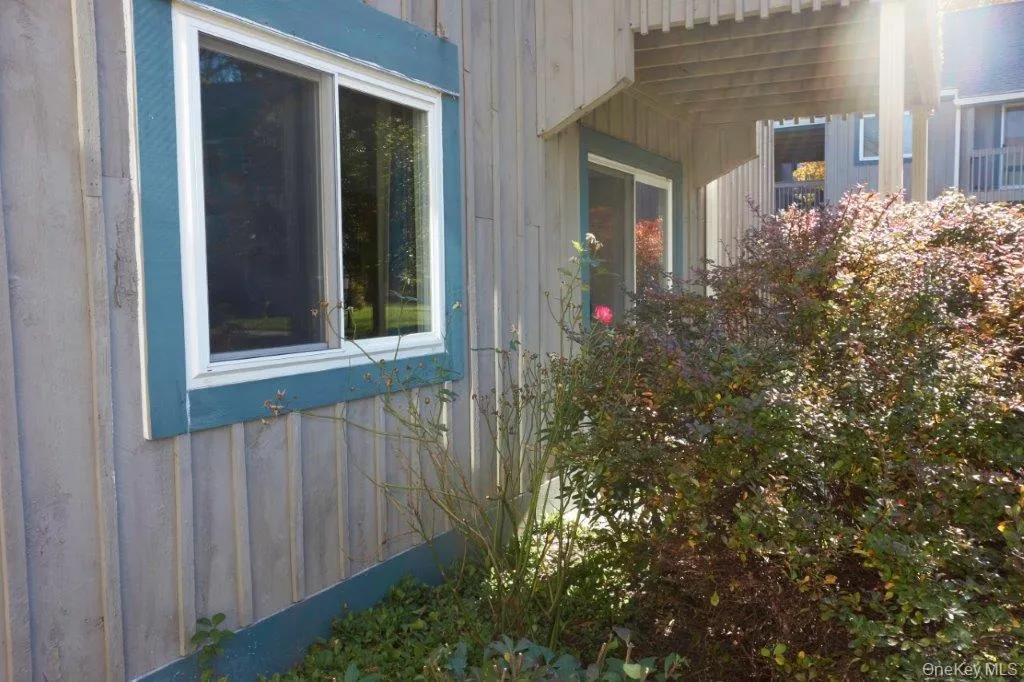 View of home's exterior featuring board and batten siding View of home's exterior featuring board and batten siding