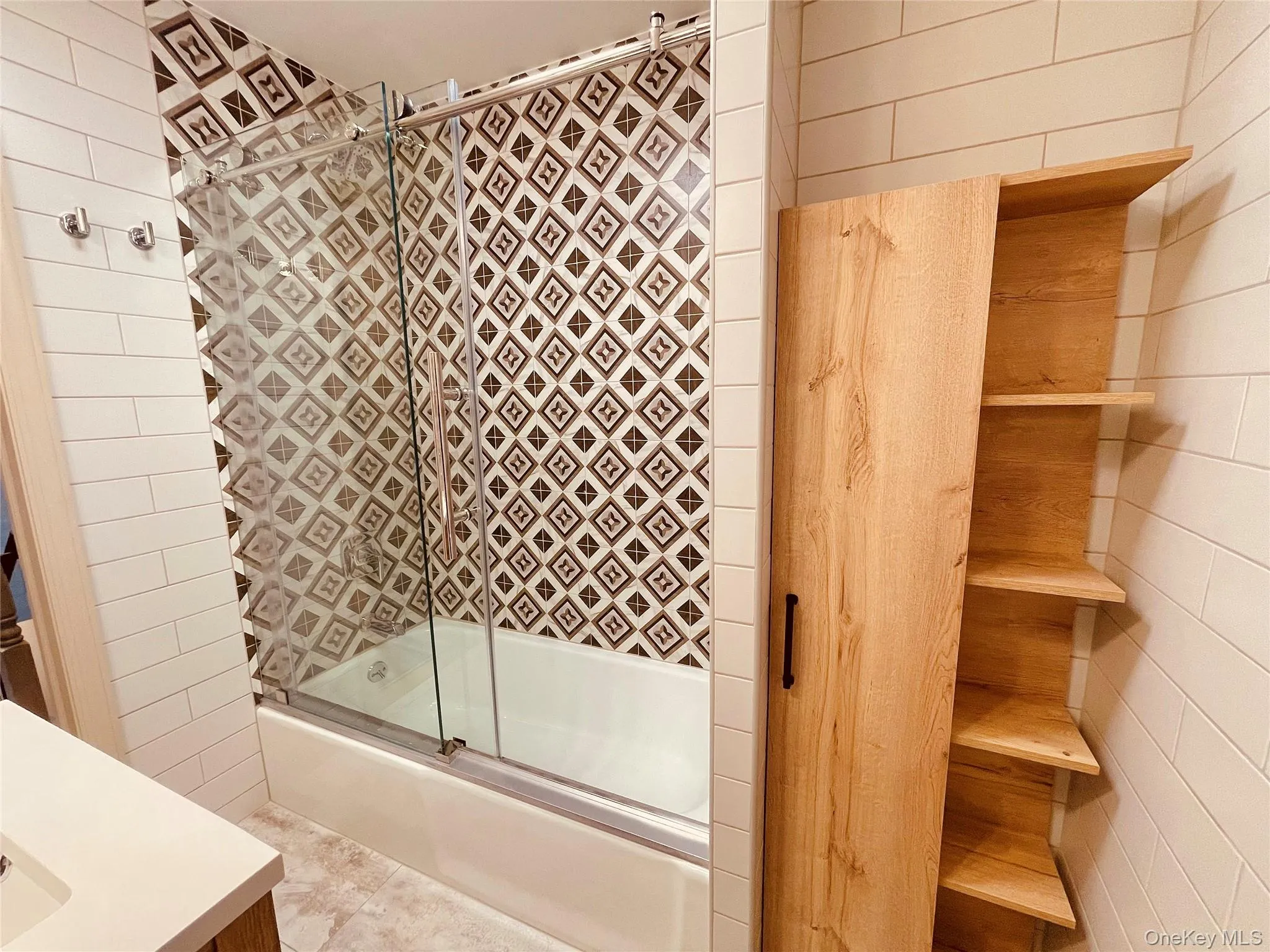 Full bathroom with enclosed tub / shower combo and vanity Full bathroom with enclosed tub / shower combo and vanity