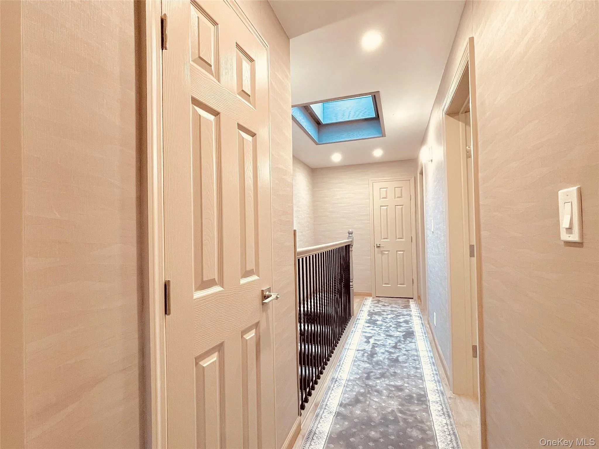 Hall with a skylight and recessed lighting Hall with a skylight and recessed lighting